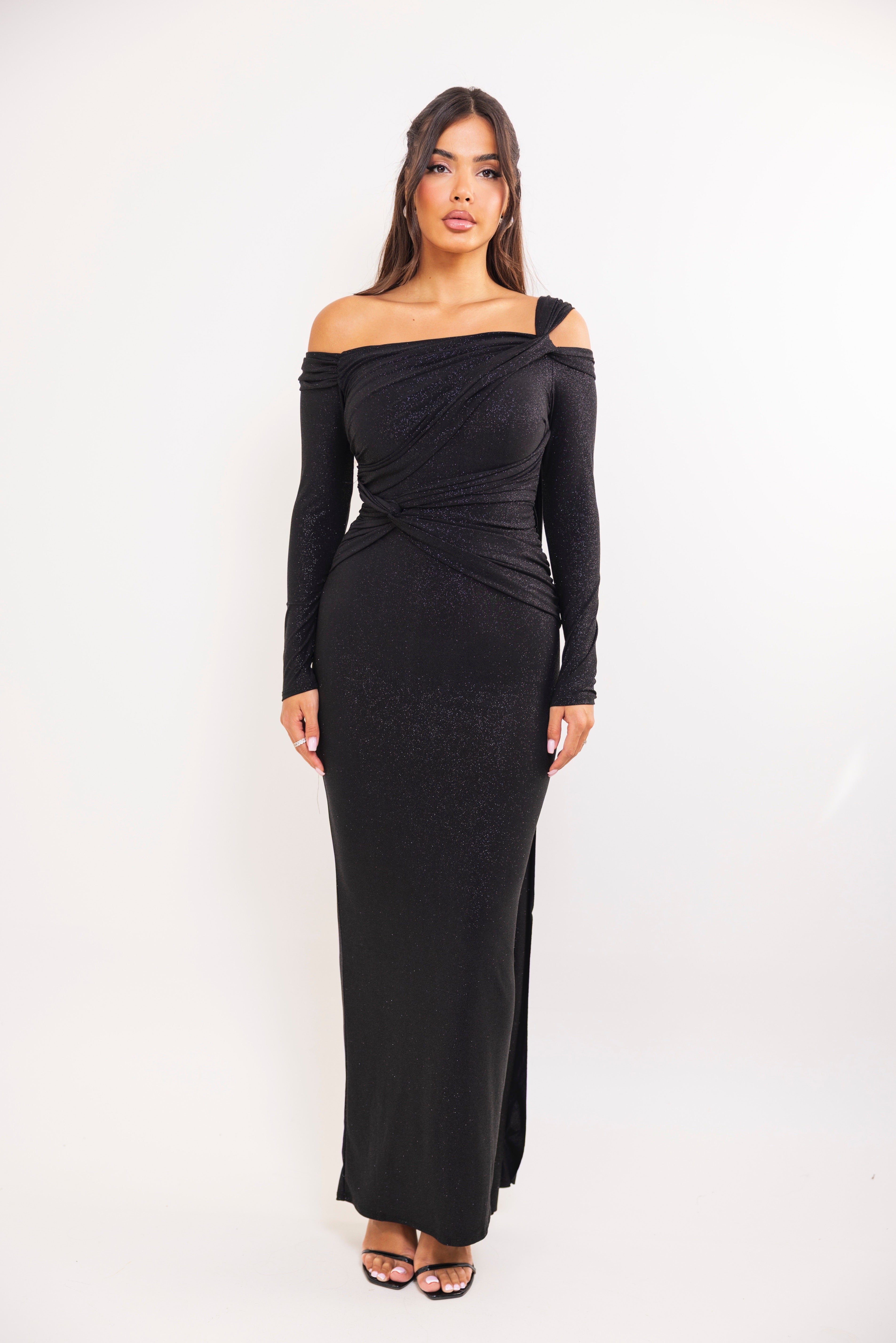 Elegant long-sleeve glitter dress featuring asymmetric neckline and ruched waist