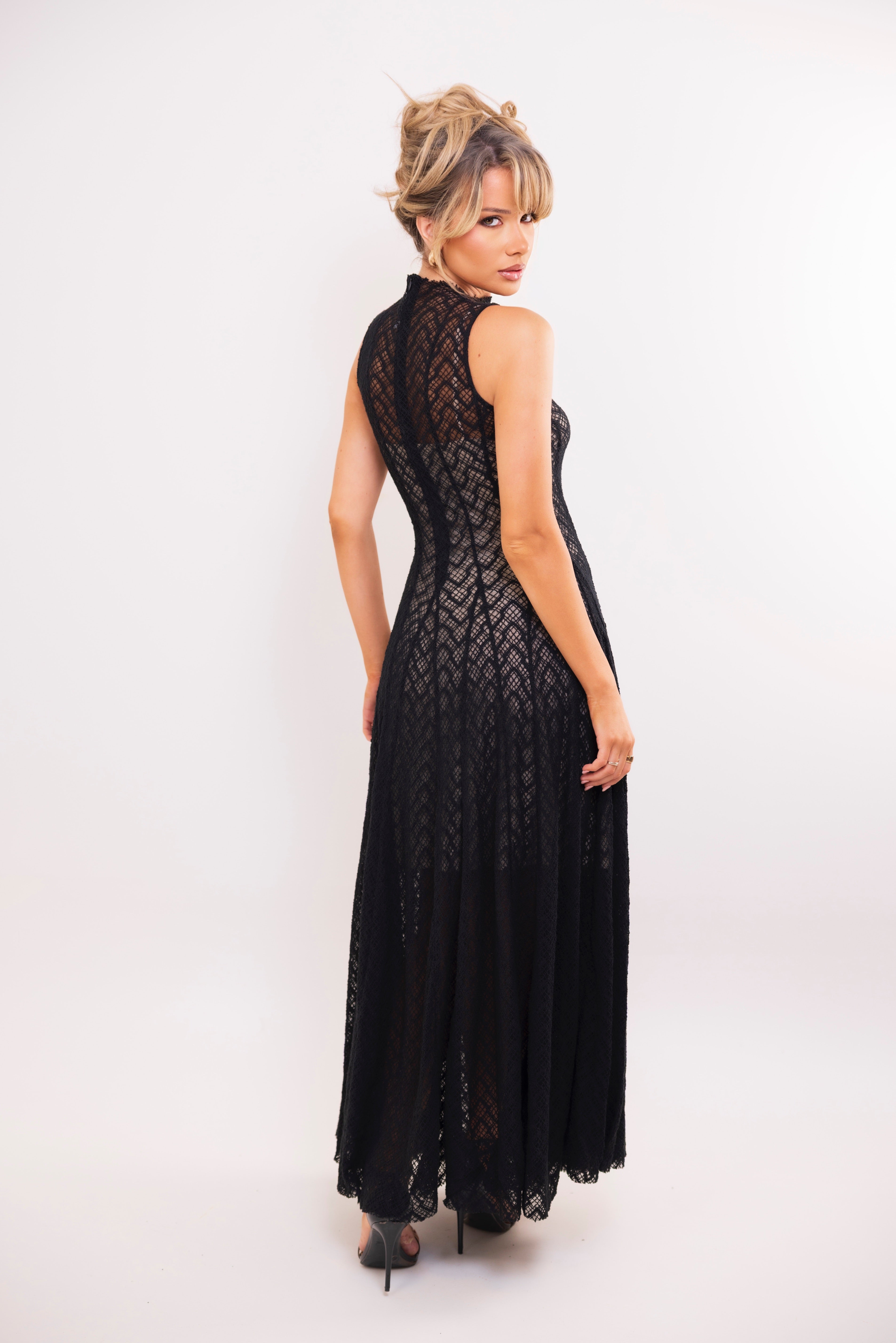 Sleeveless black lace maxi dress with nude lining and high mock neckline
