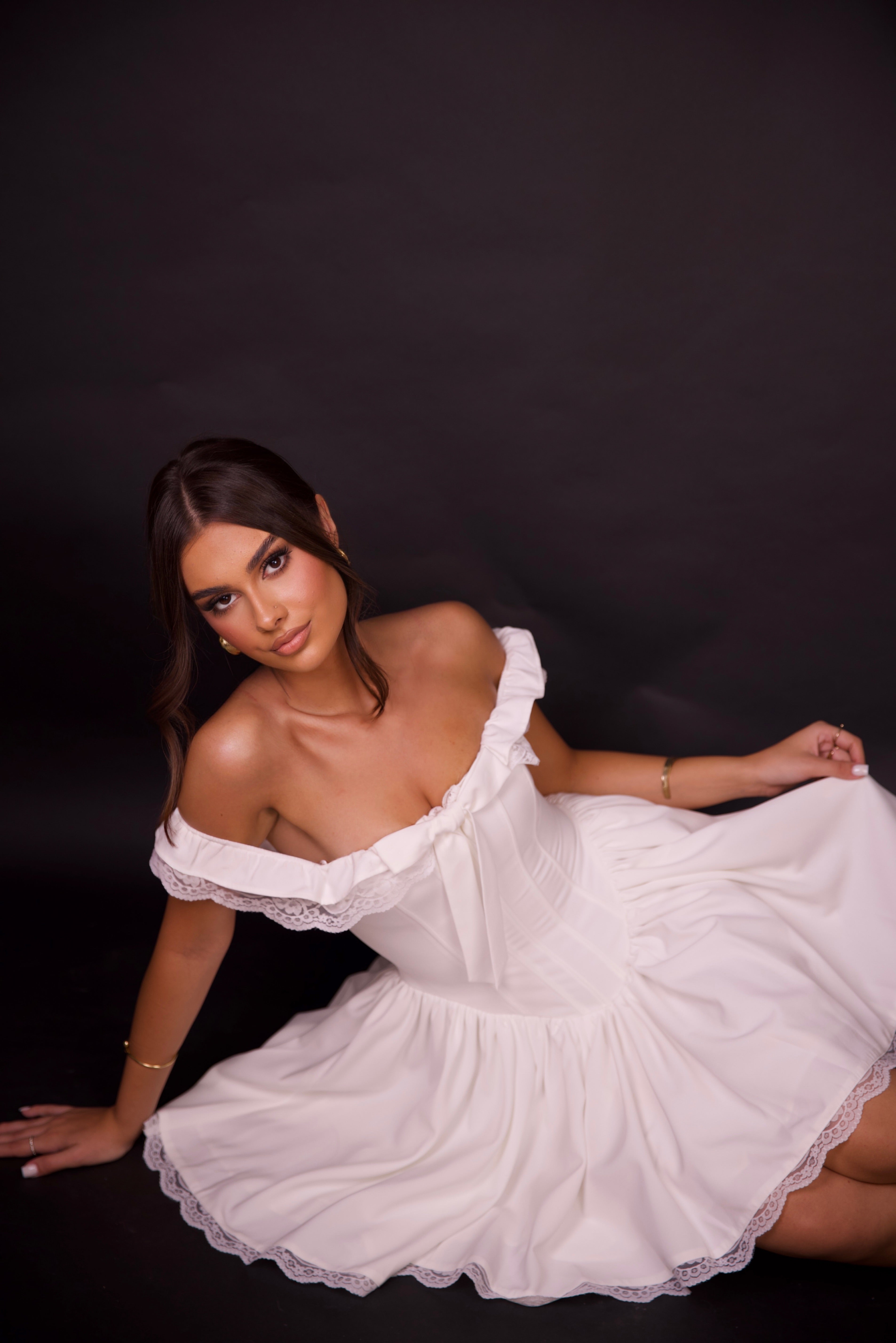 Corset-style white dress with bow detail