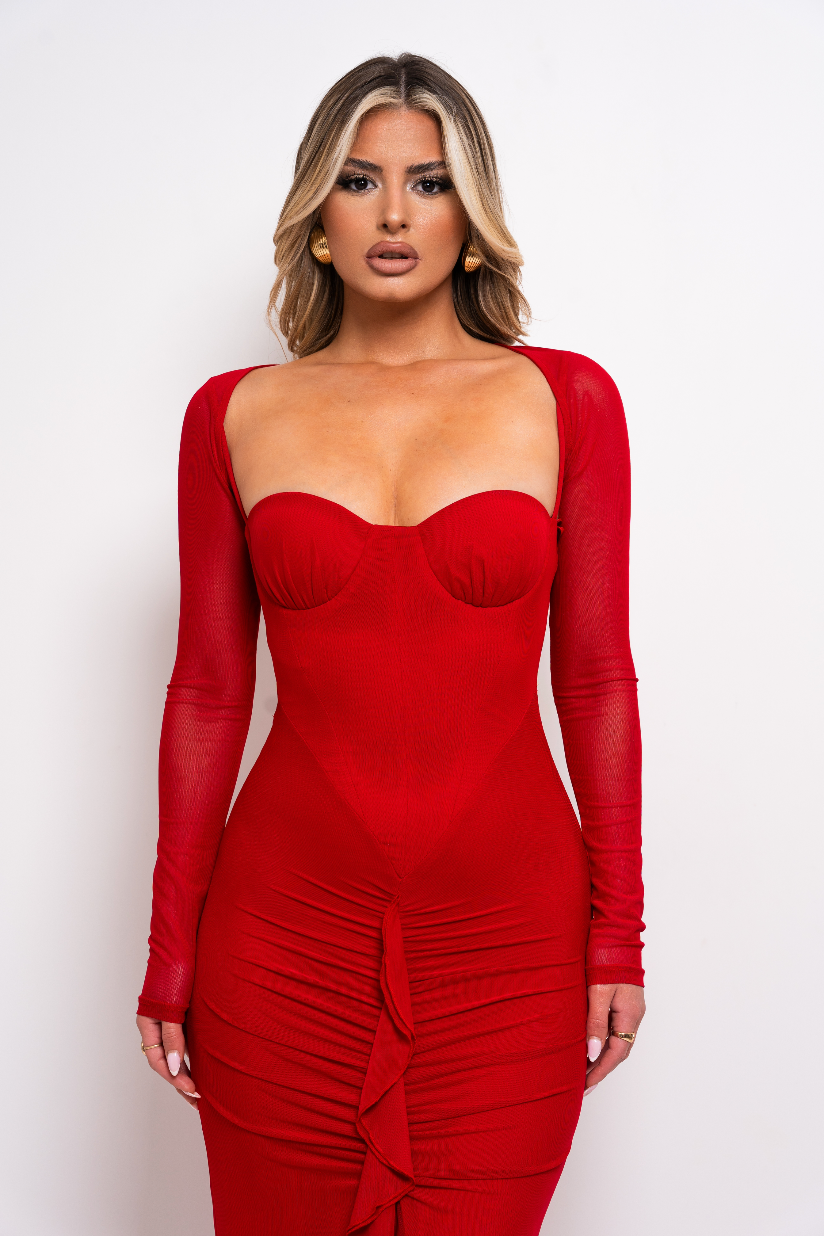 Chic red maxi dress with structured bustier bodice and front slit ruffle detail.