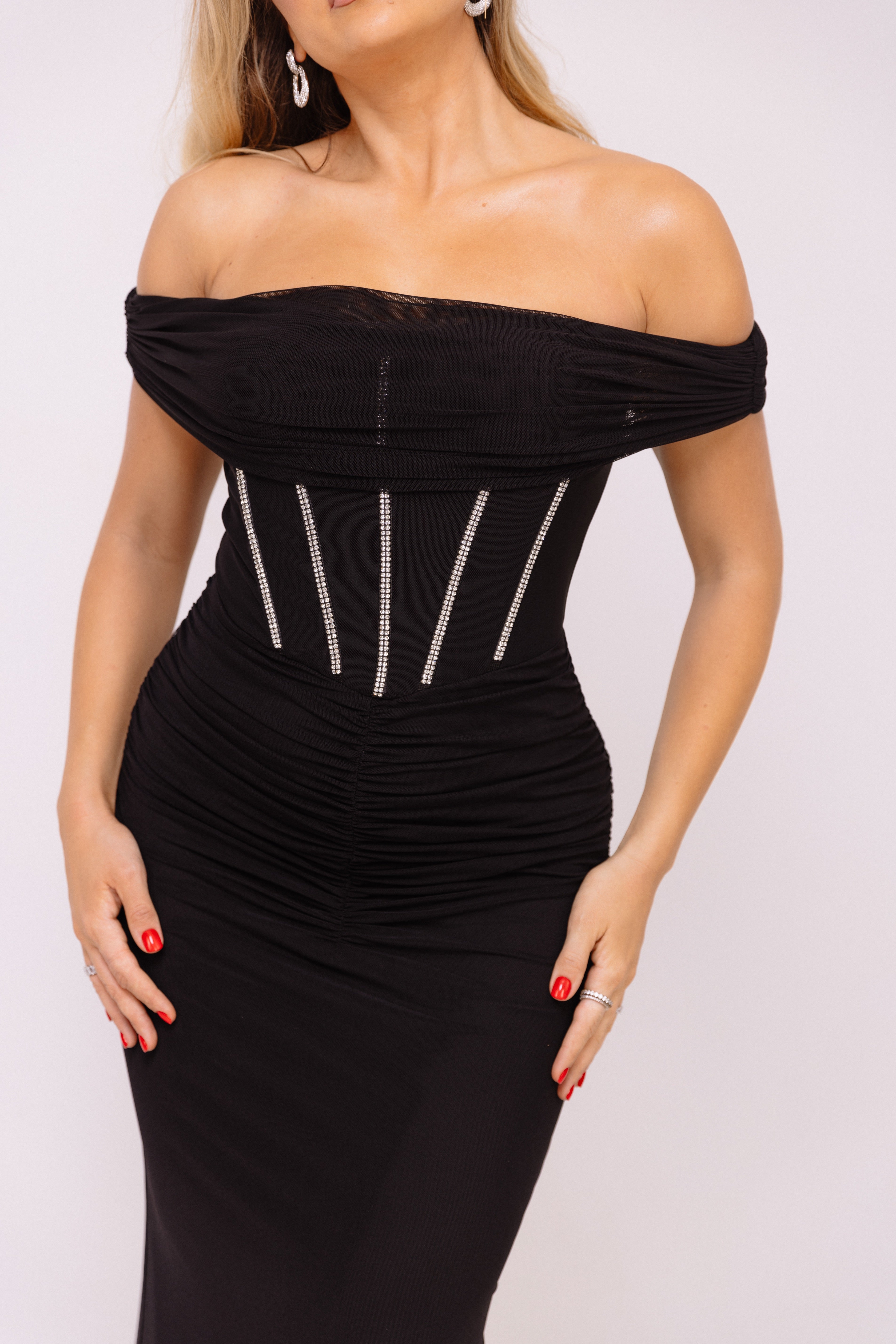 Elegant black dress featuring rhinestone accents on the bodice