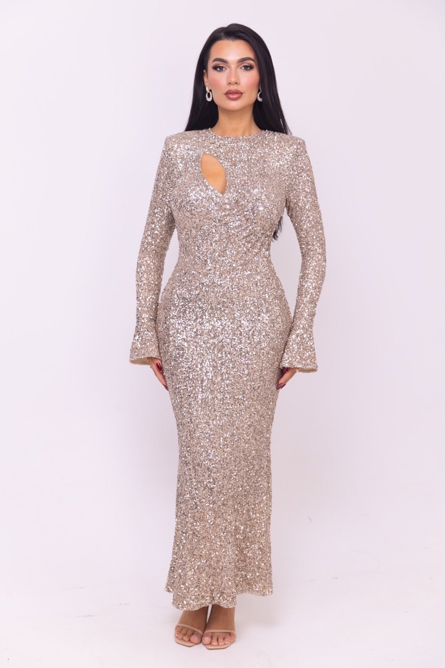 Long fitted dress with glitter accents and a unique neckline