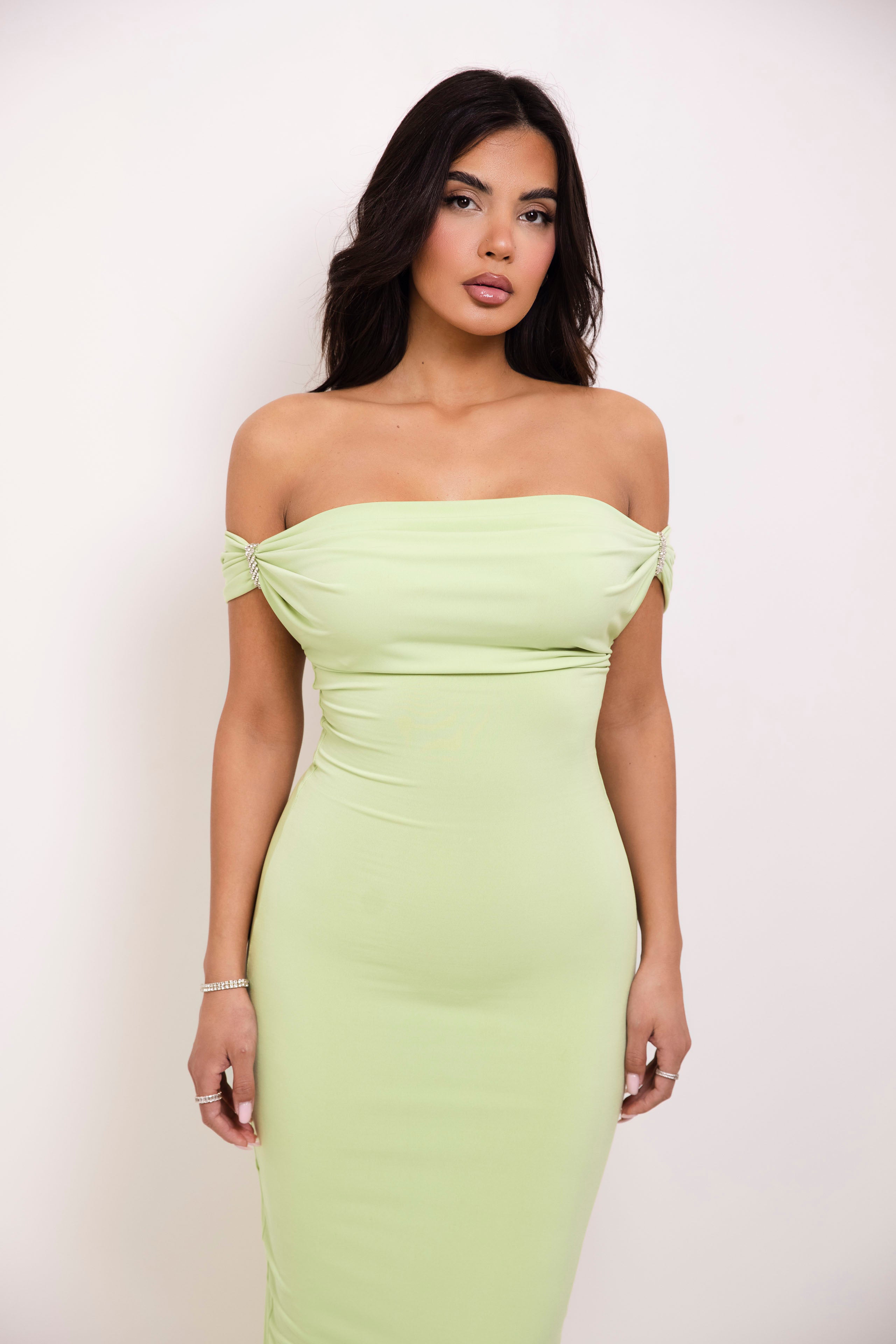 Sophisticated slim-fit gown in soft lime green, ideal for prom or formal events.