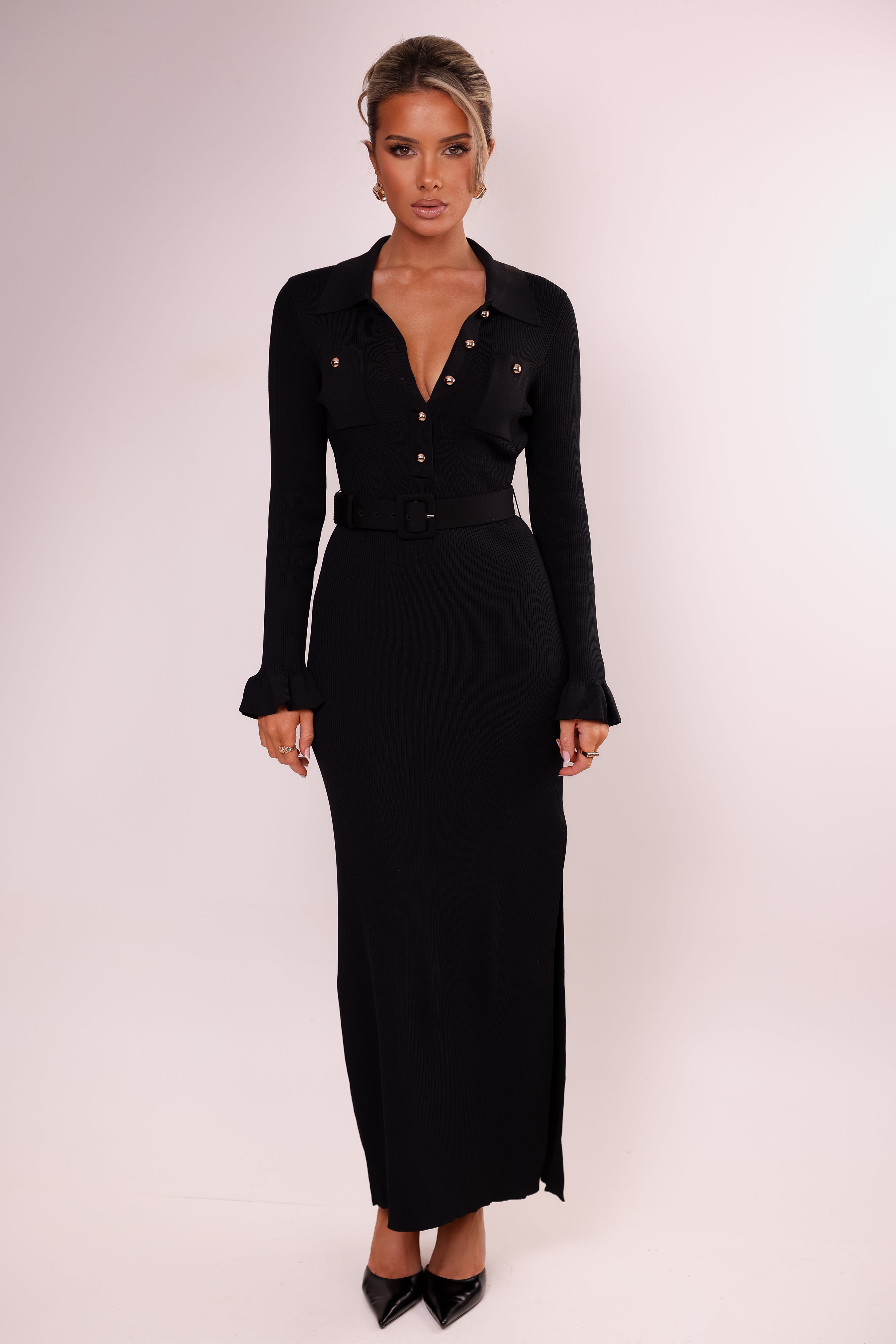 Woman wearing a black outfit with a white background