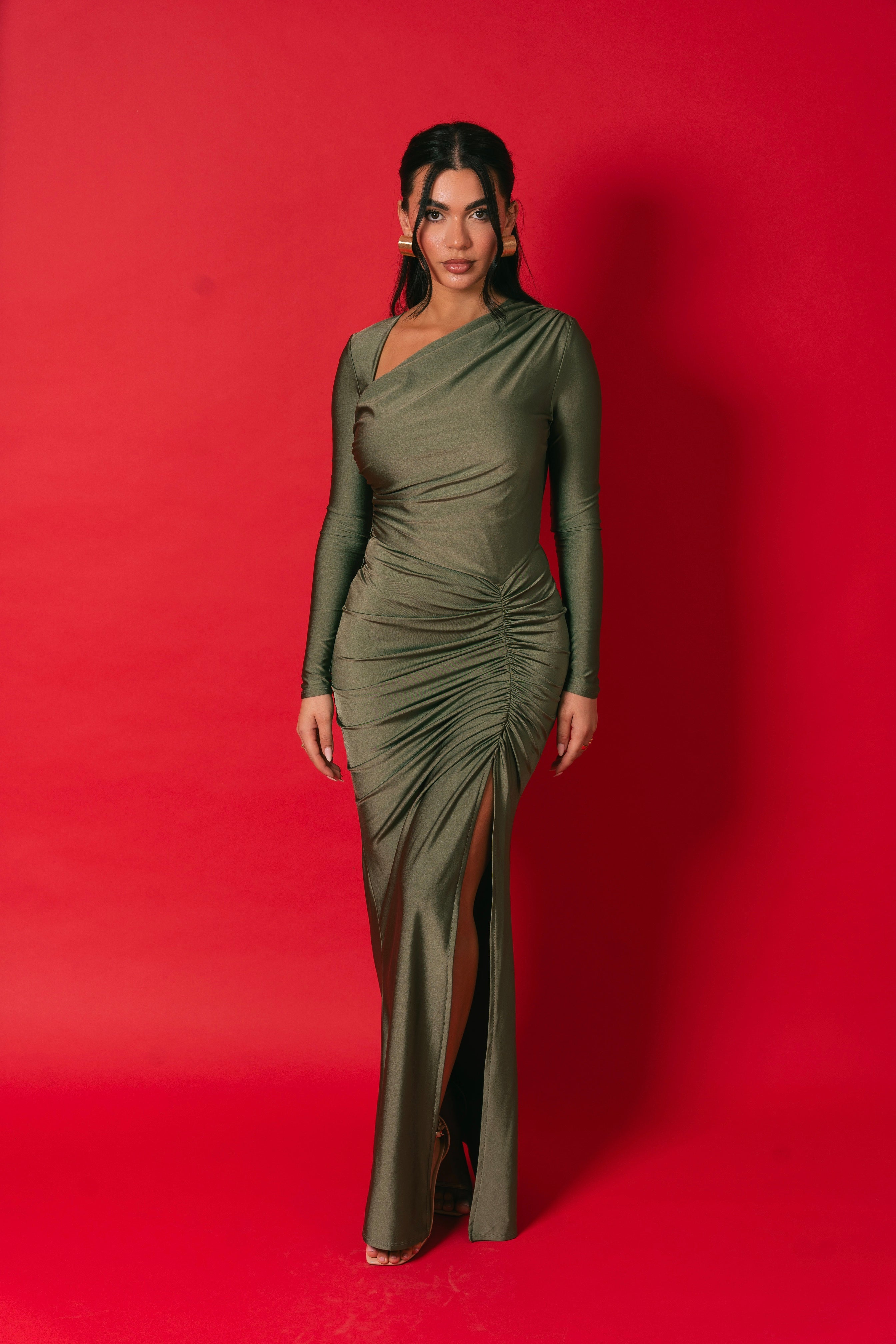 Form-fitting olive dress with a flattering side gather and front thigh slit.