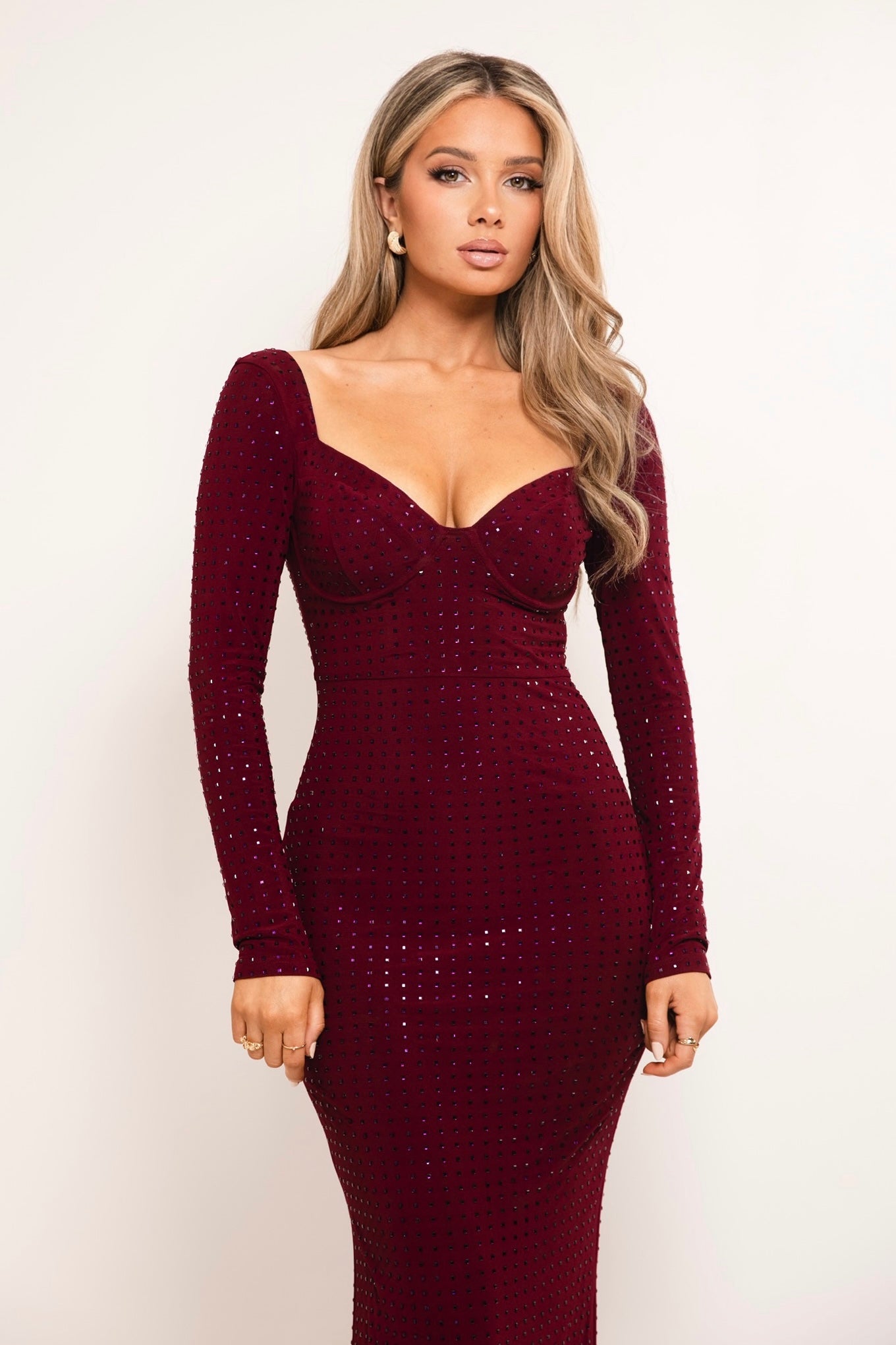 Elegant wine-colored maxi dress featuring sparkling embellishments.