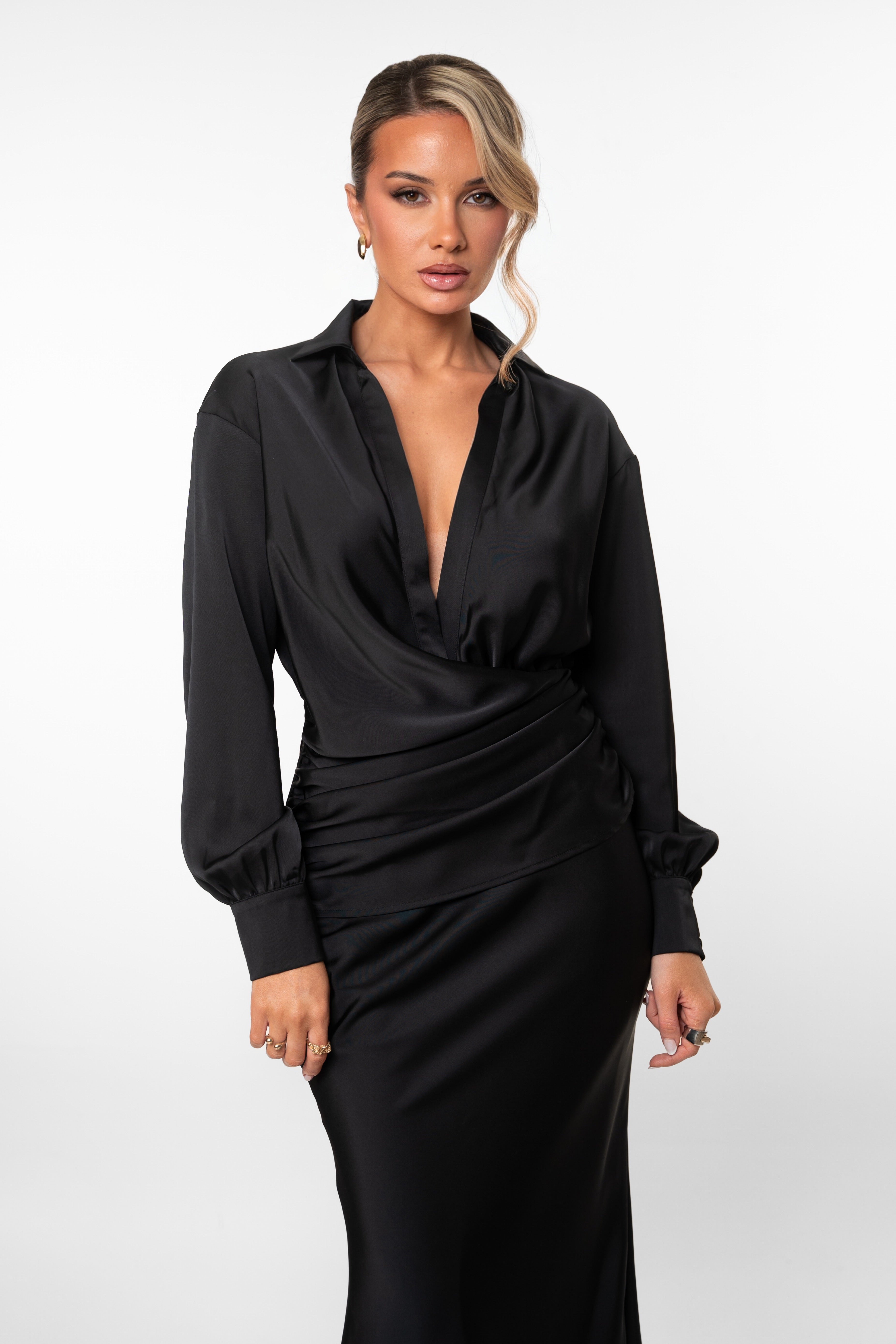 Woman wearing a black dress on a white background