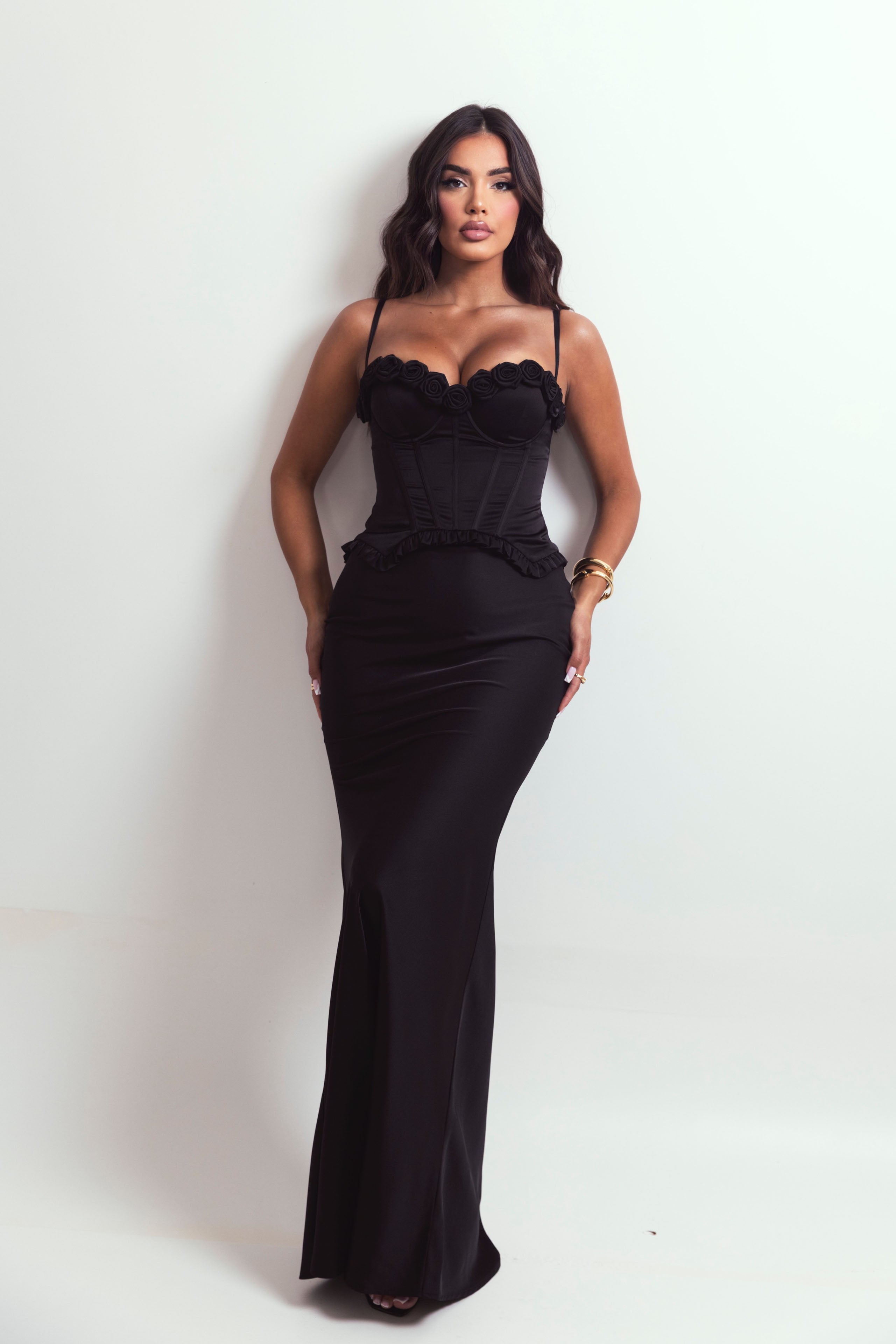 Black satin set featuring a sculpted top and flowing mermaid-style skirt