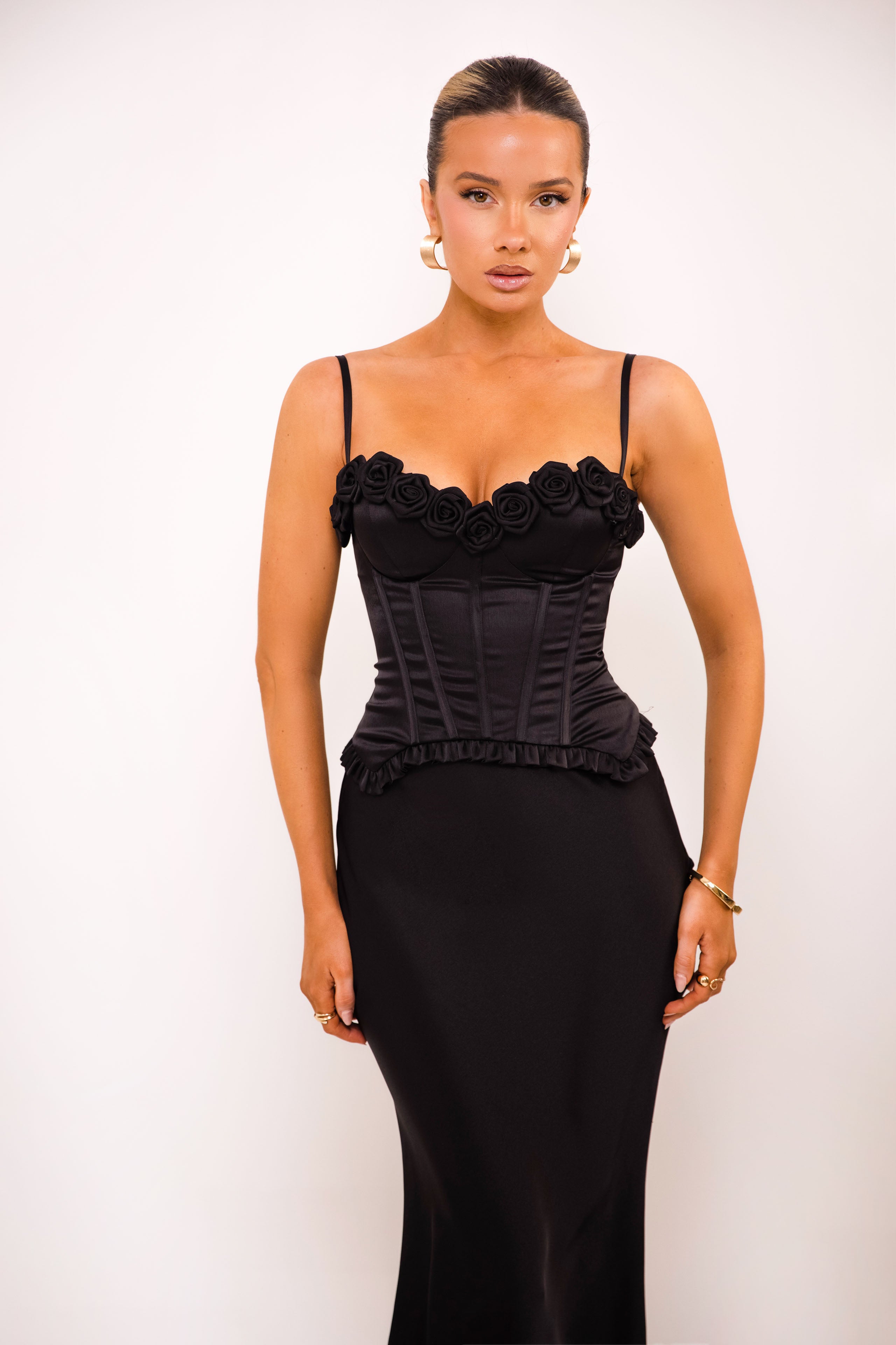 Elegant corset featuring boning and gathered rose embellishments