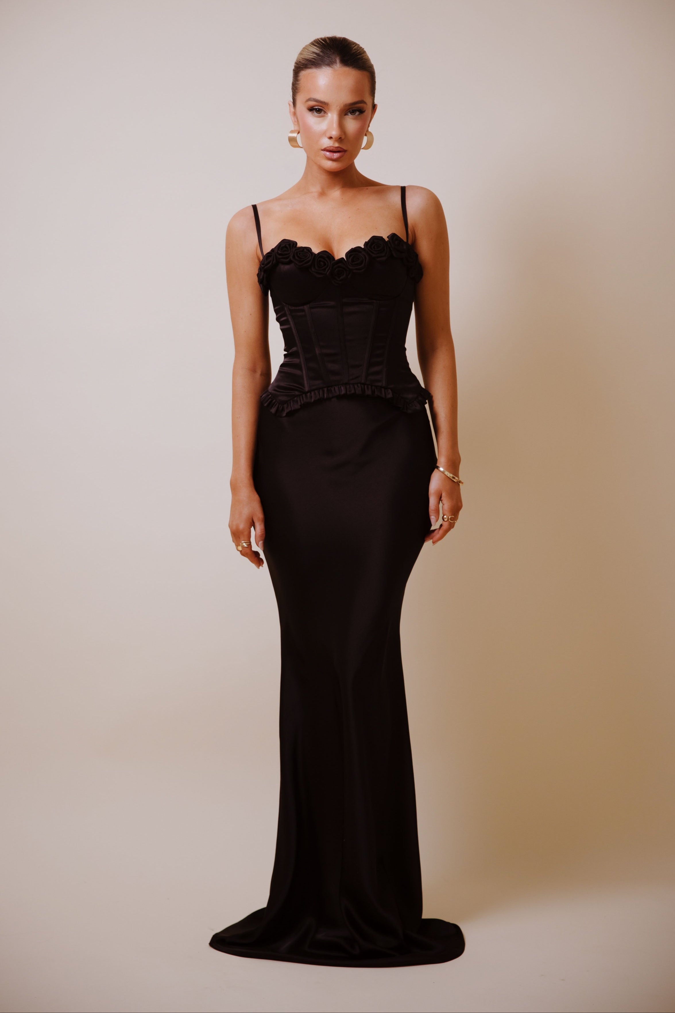 Satin corset top with 3D black rose detailing along the neckline