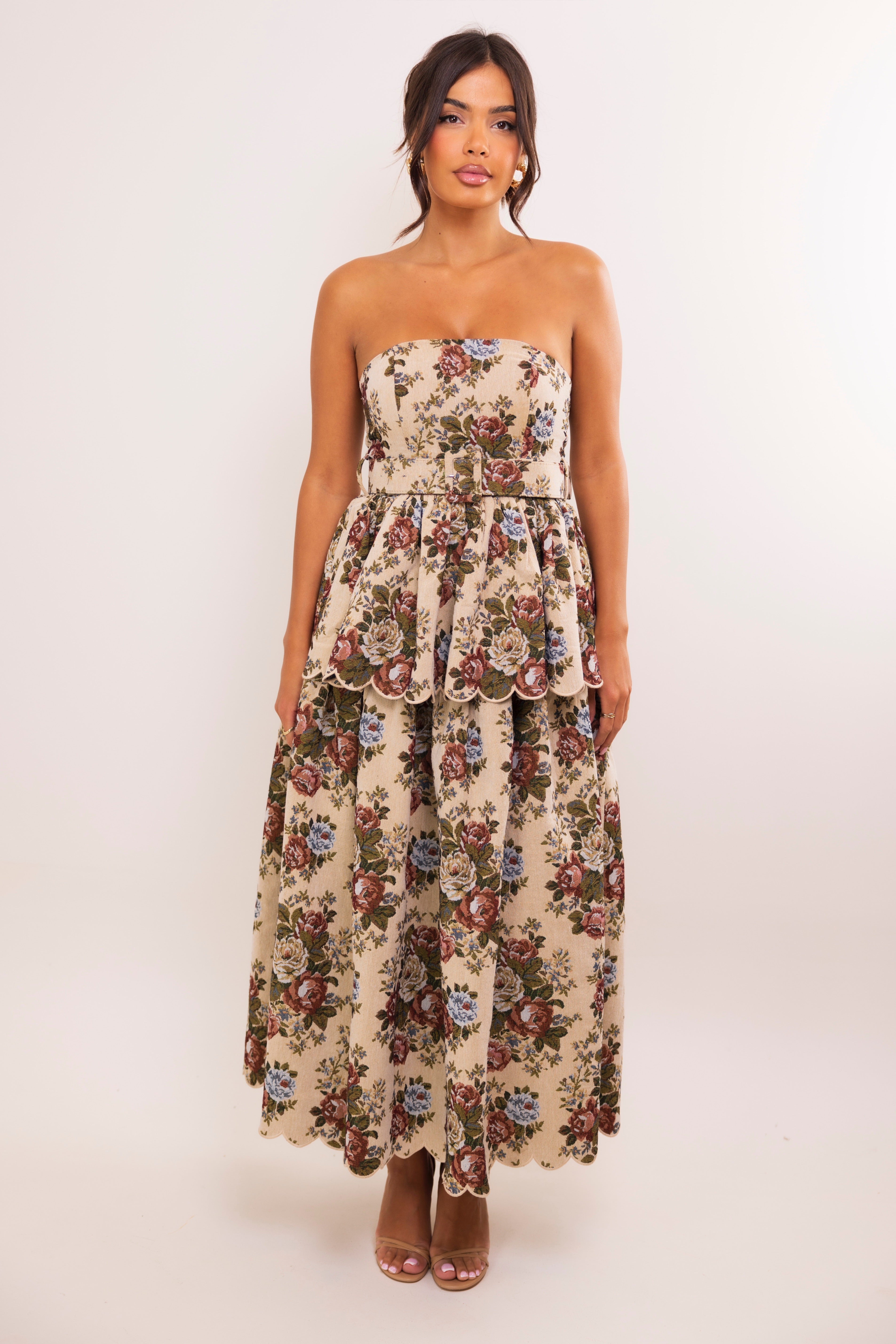 Elegant floral print midi dress featuring structured strapless bodice and tiered peplum detailing