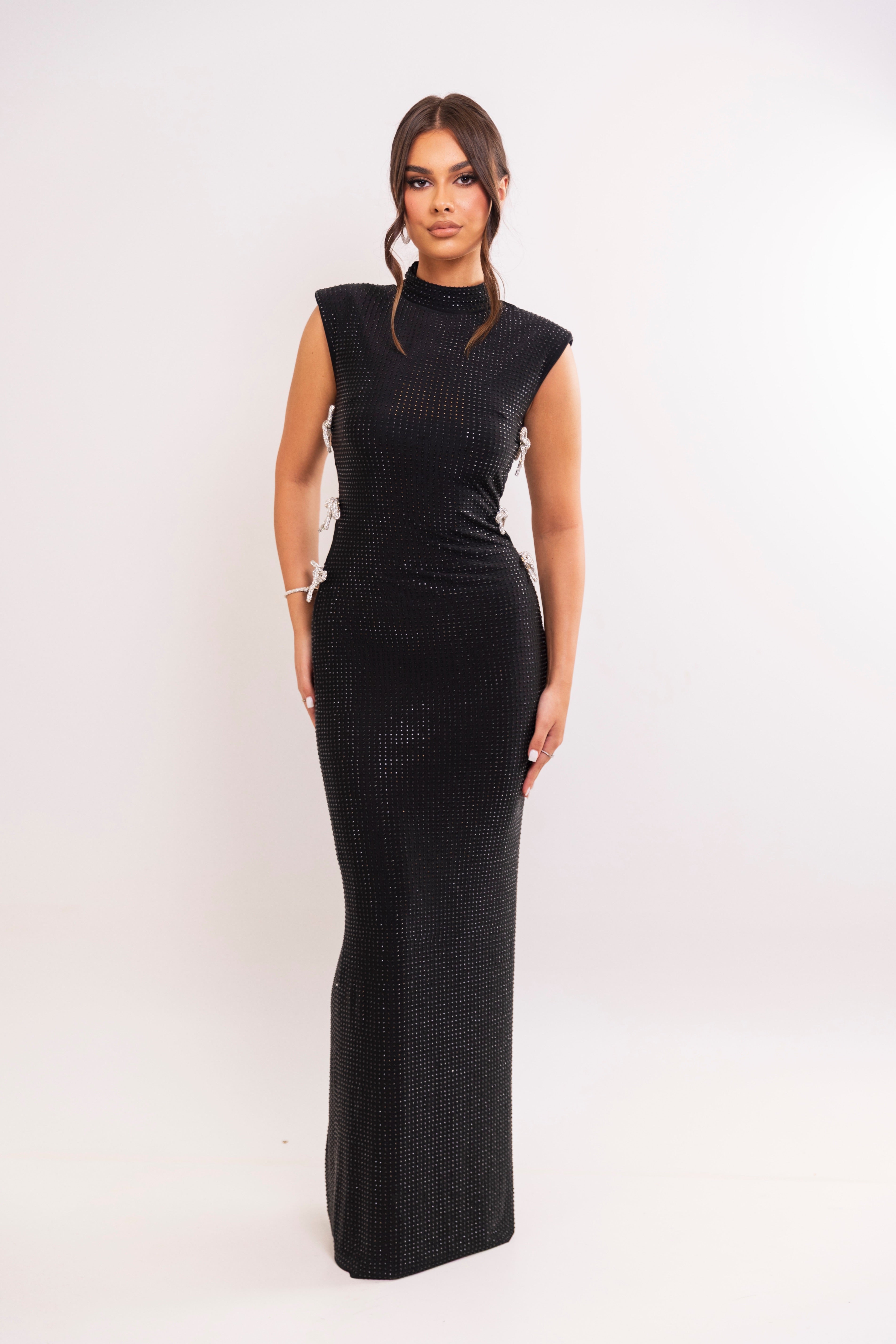 Black high-neck gown with rhinestone bow cutouts