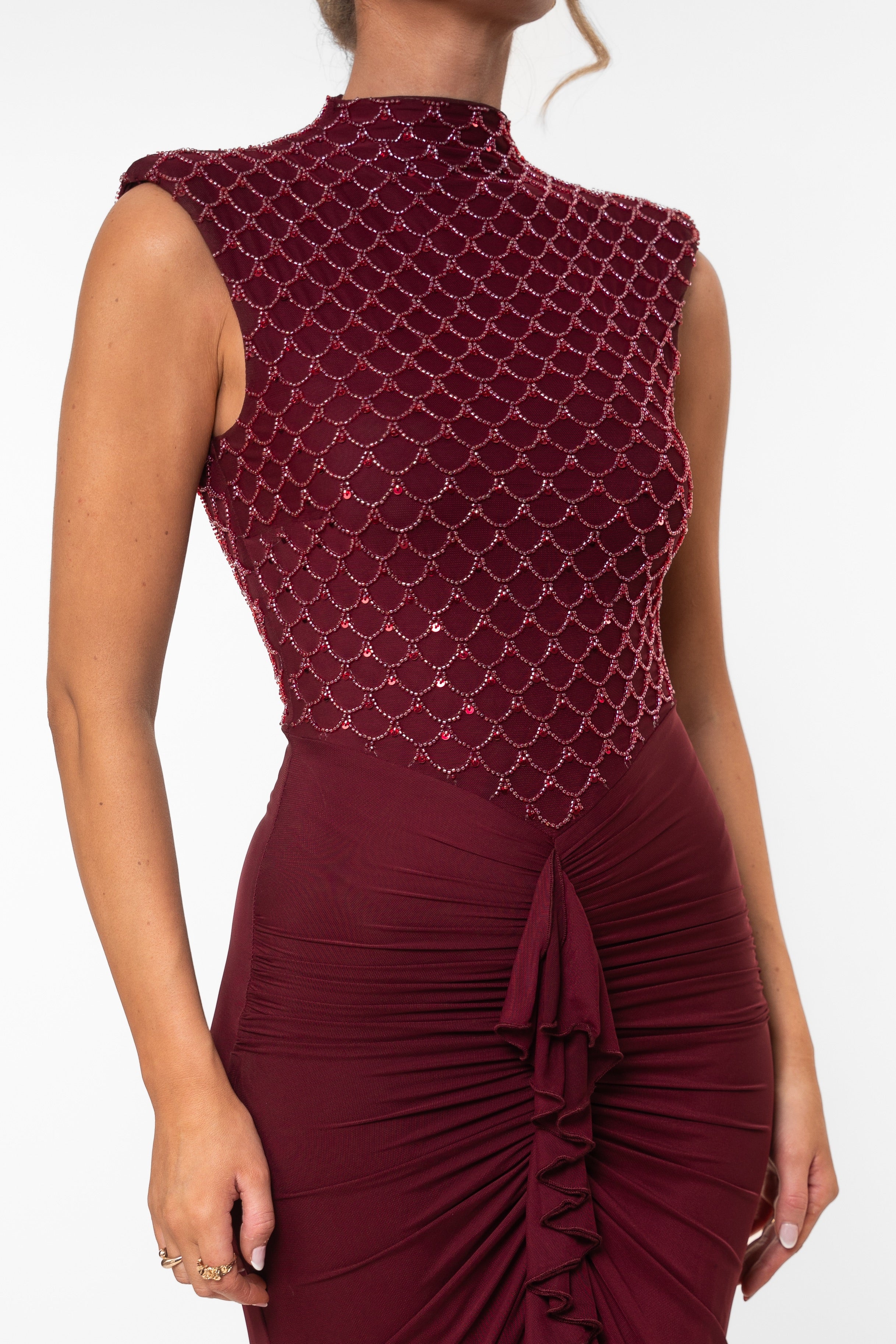 Sophisticated maroon gown with sleeveless sequined bodice and ruched front detail