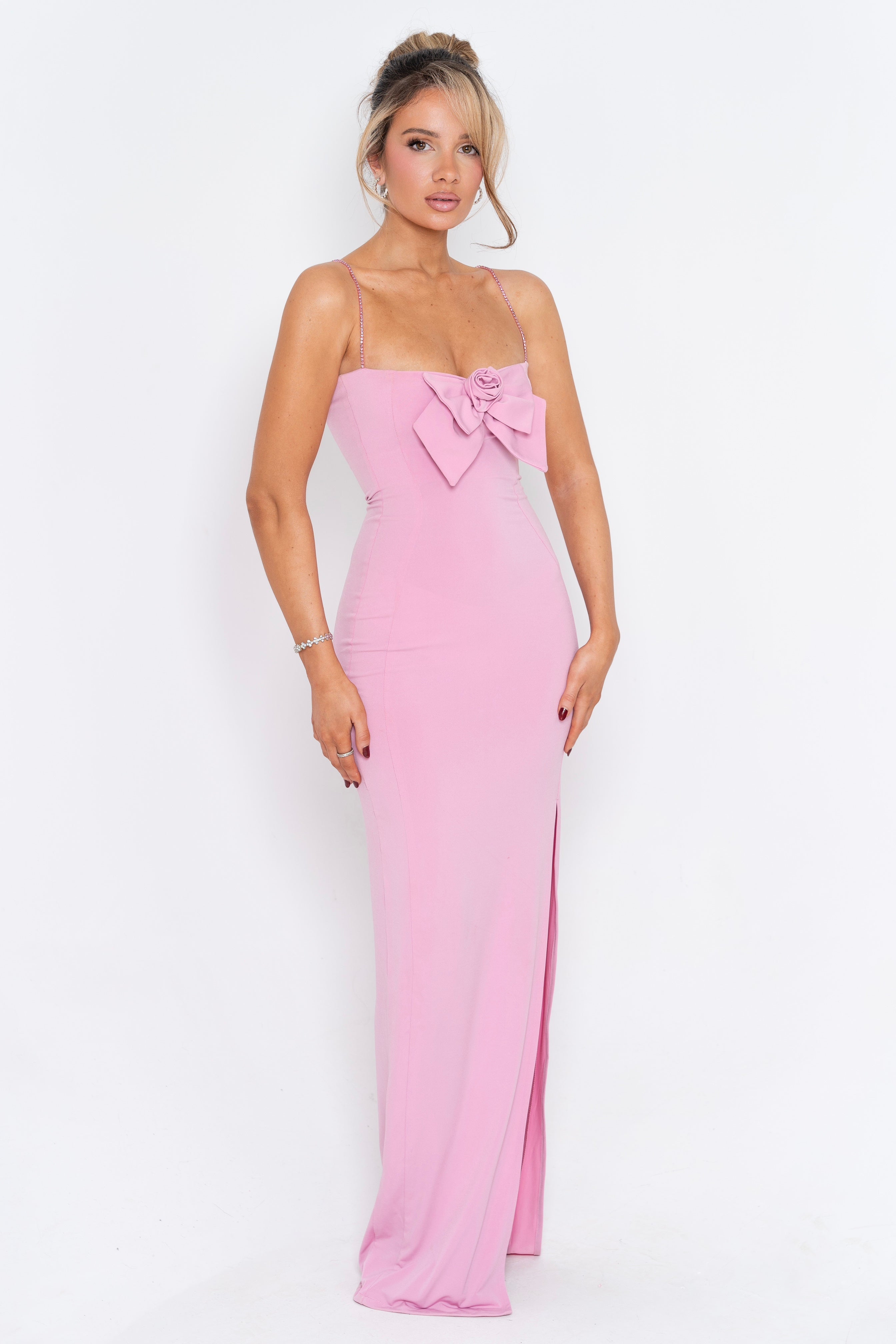 Feminine pastel pink dress with a flower accent at the bust, perfect for formal or semi-formal occasions.