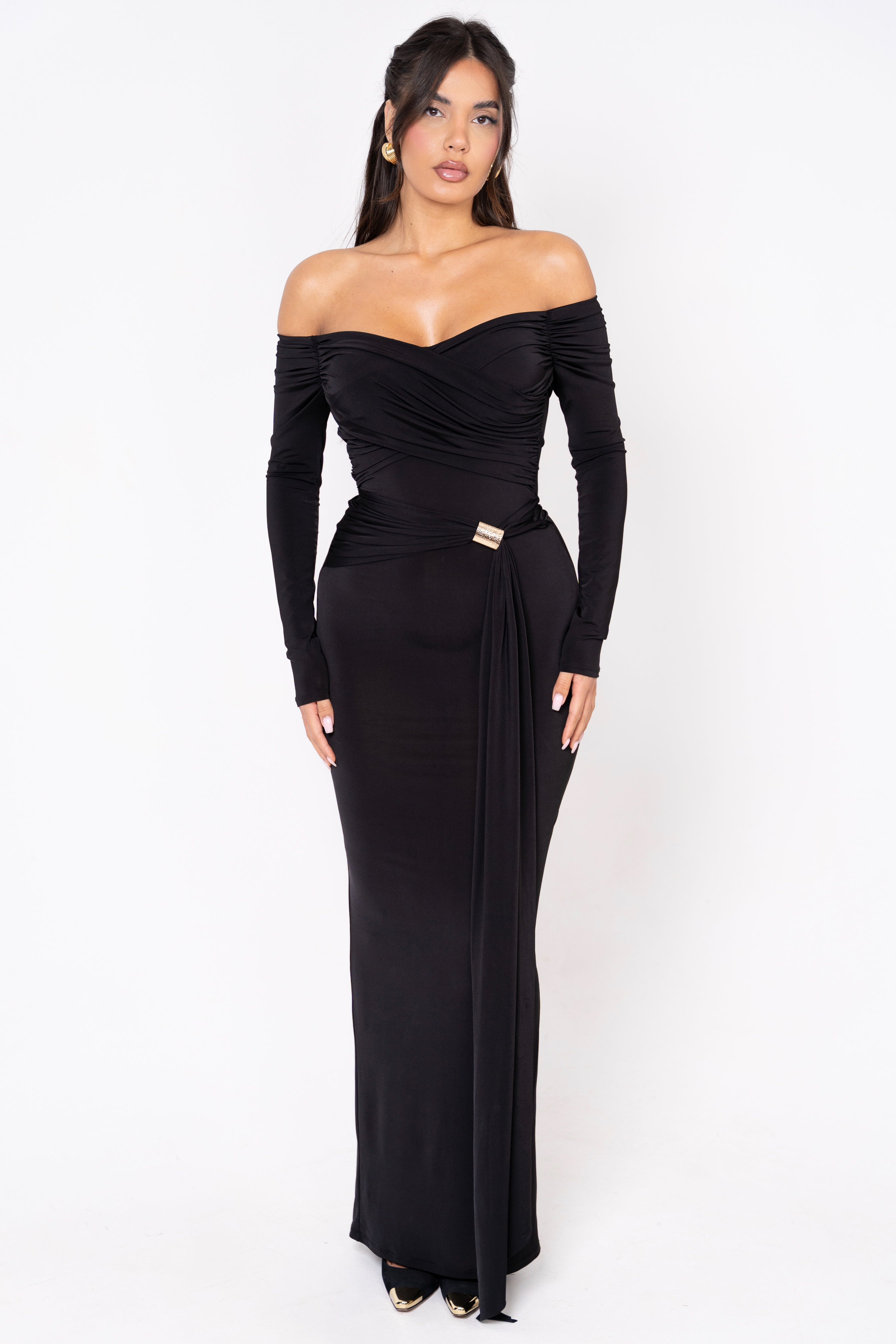 Off-shoulder black gown with elegant draped detailing