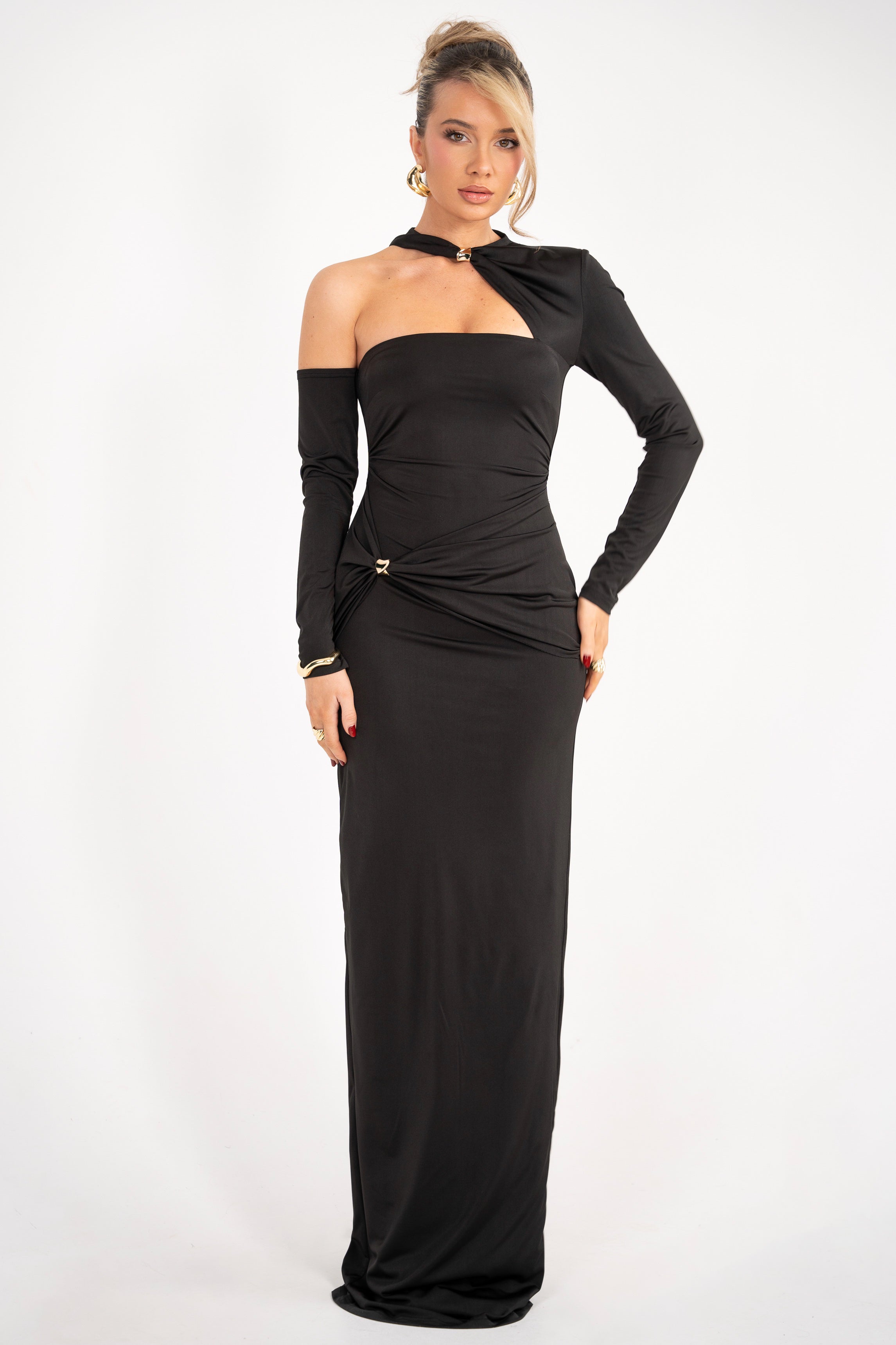 Classy long black gown with a fitted silhouette, featuring a single long sleeve and off-shoulder design.