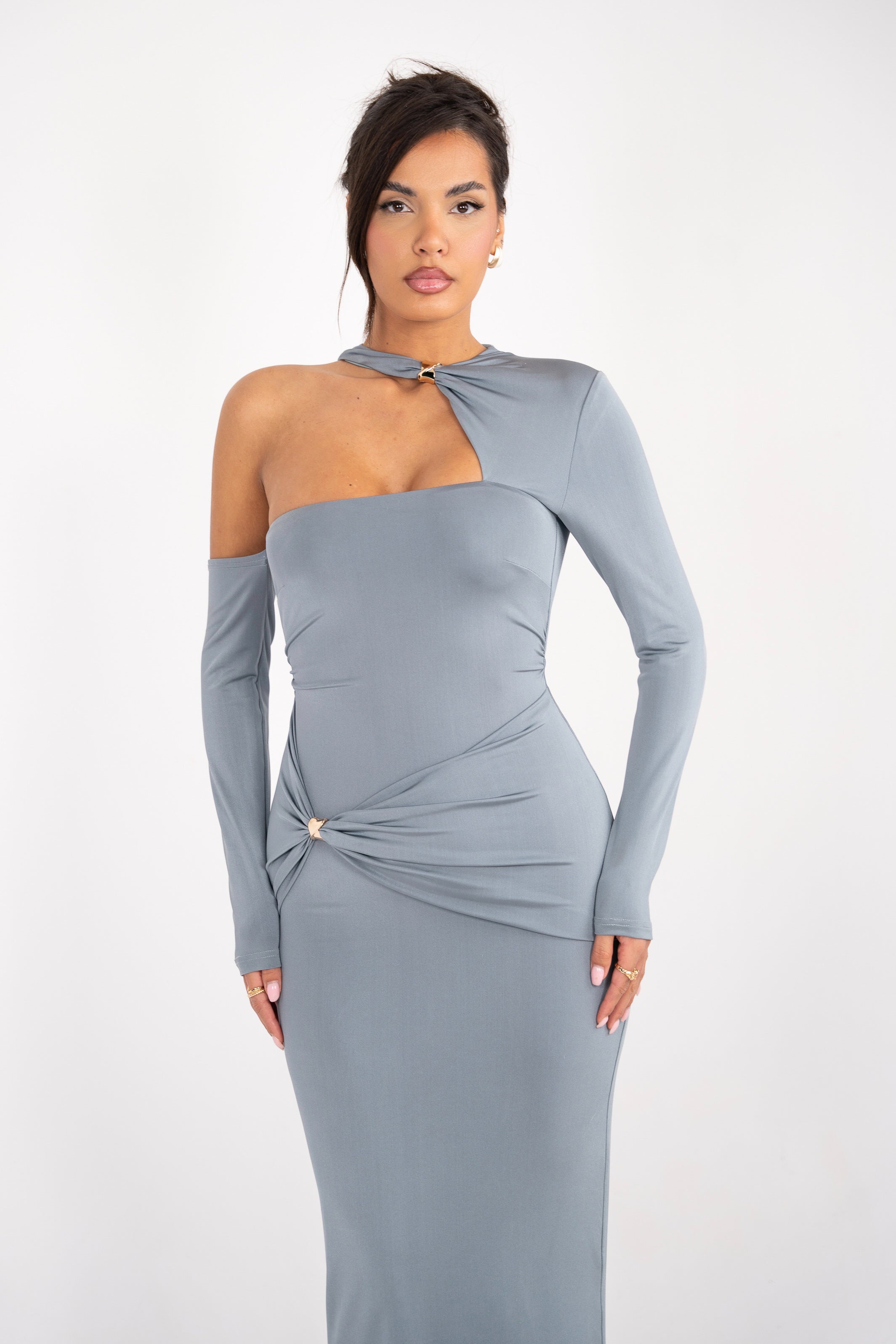 Grey formal dress with a ruched waistline and a modern, asymmetric sleeve style.