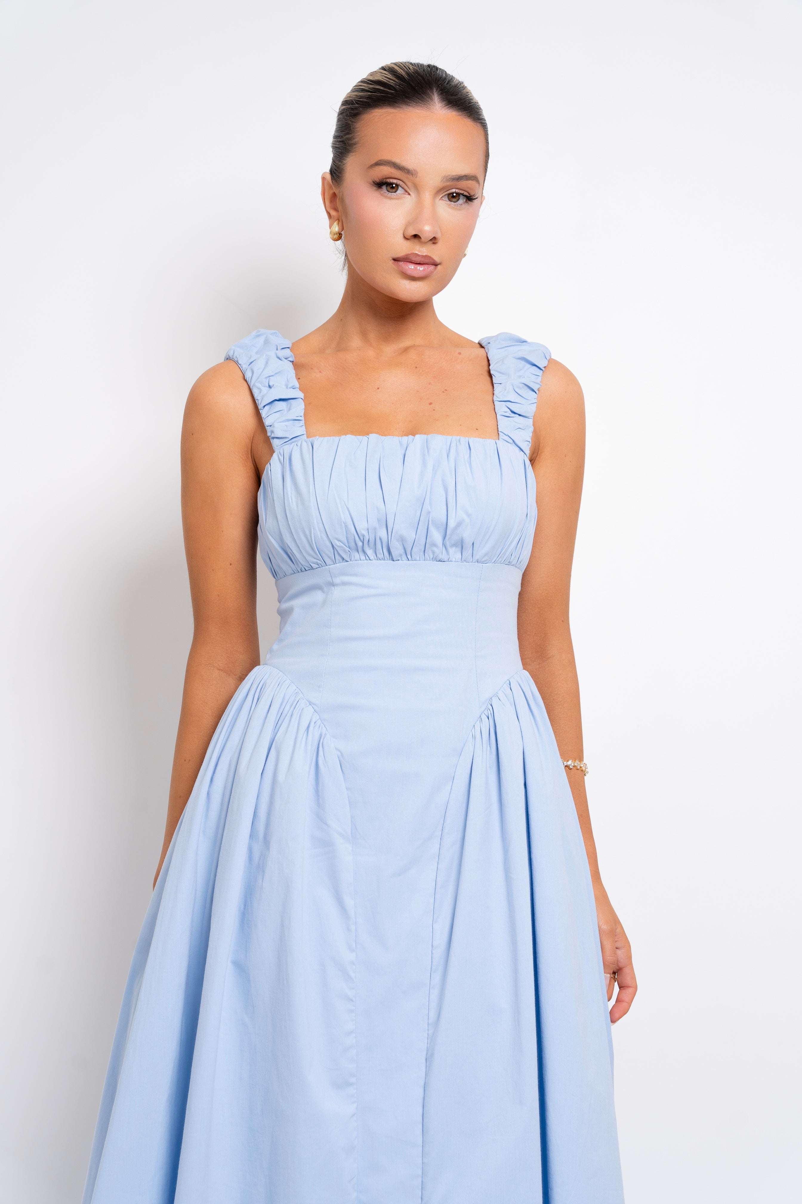 Light blue maxi dress with ruffled straps.