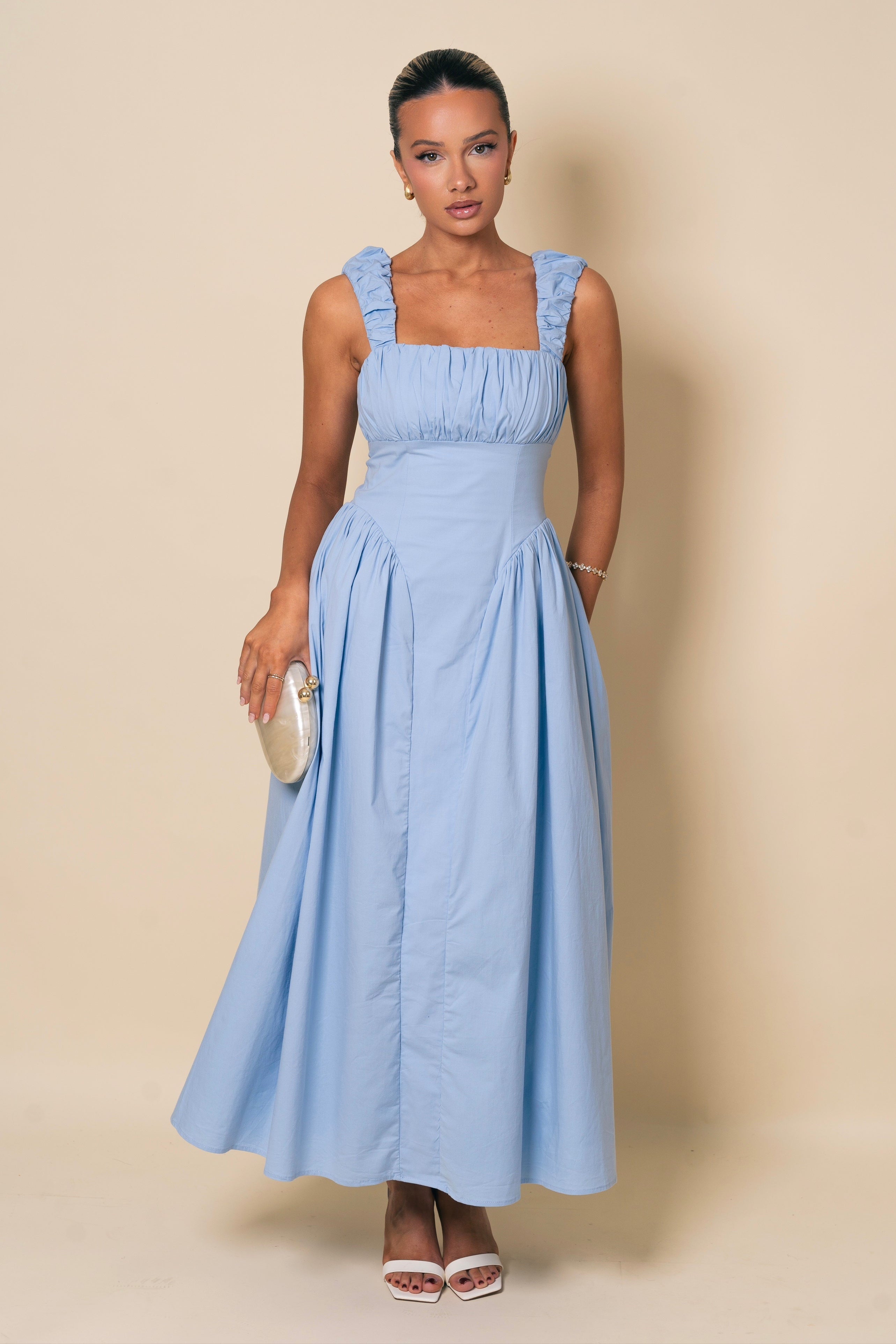 Square-neckline gown with gathered details.