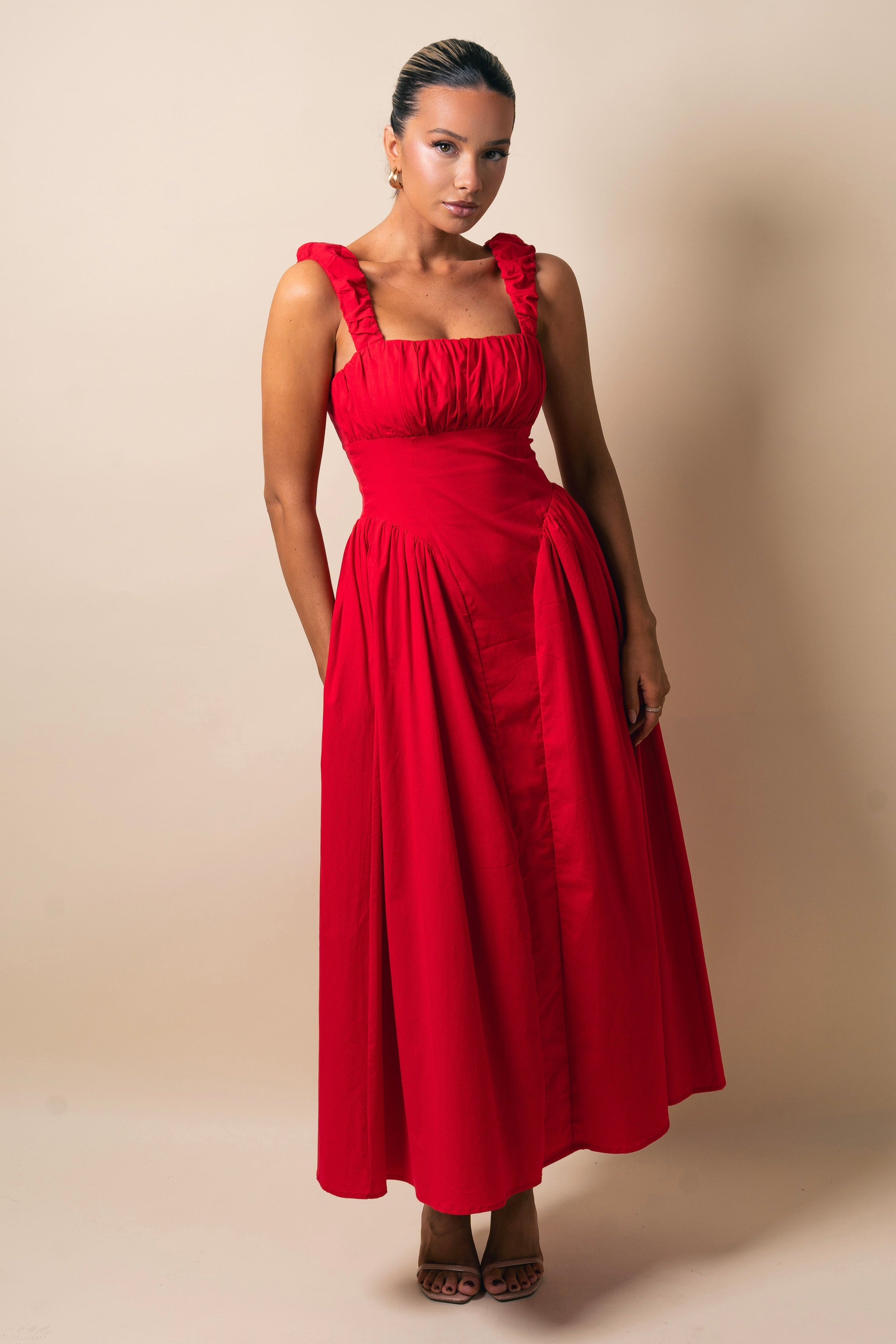 Sleeveless ruched maxi dress in bright red.