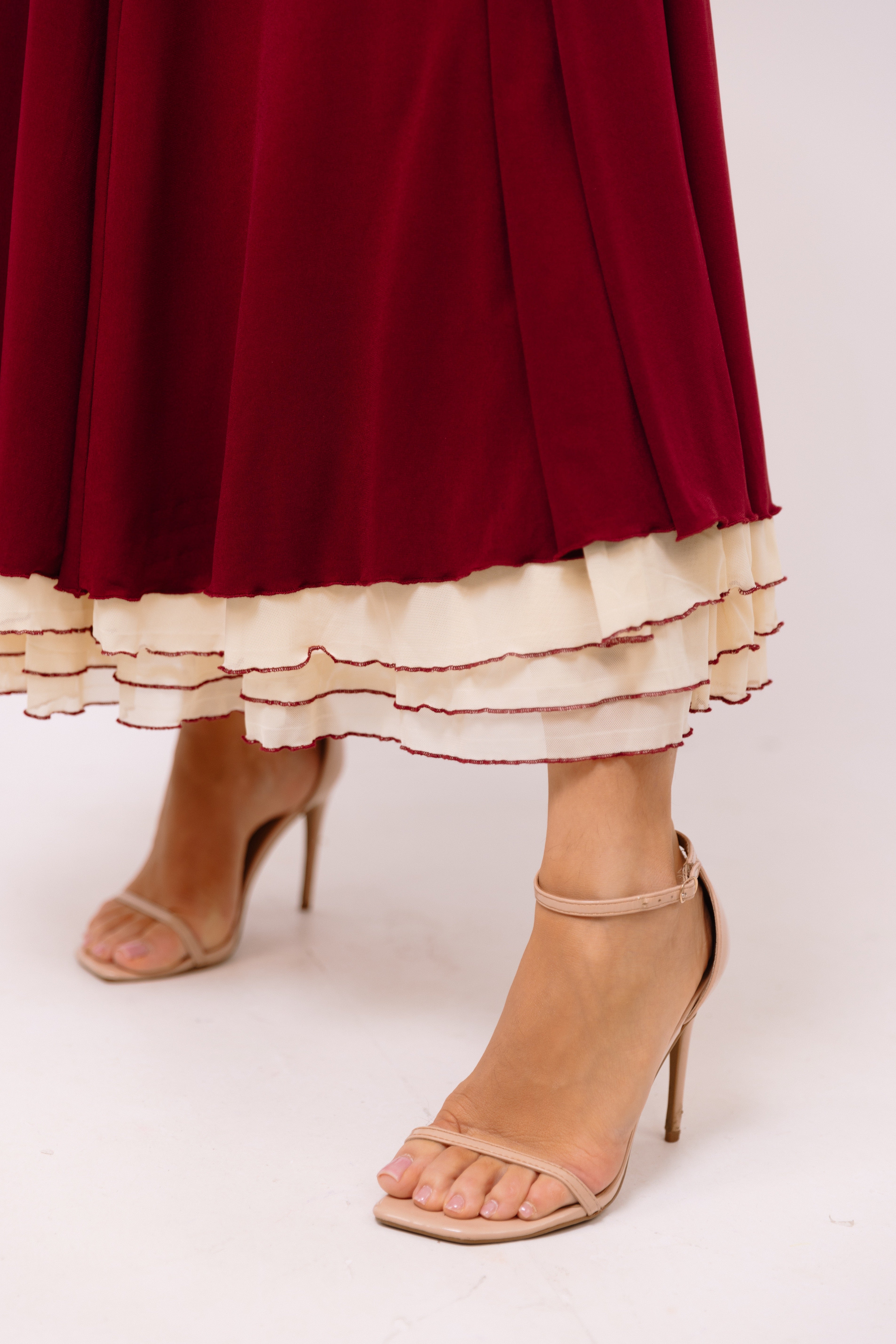 Burgundy evening dress with layered hem details