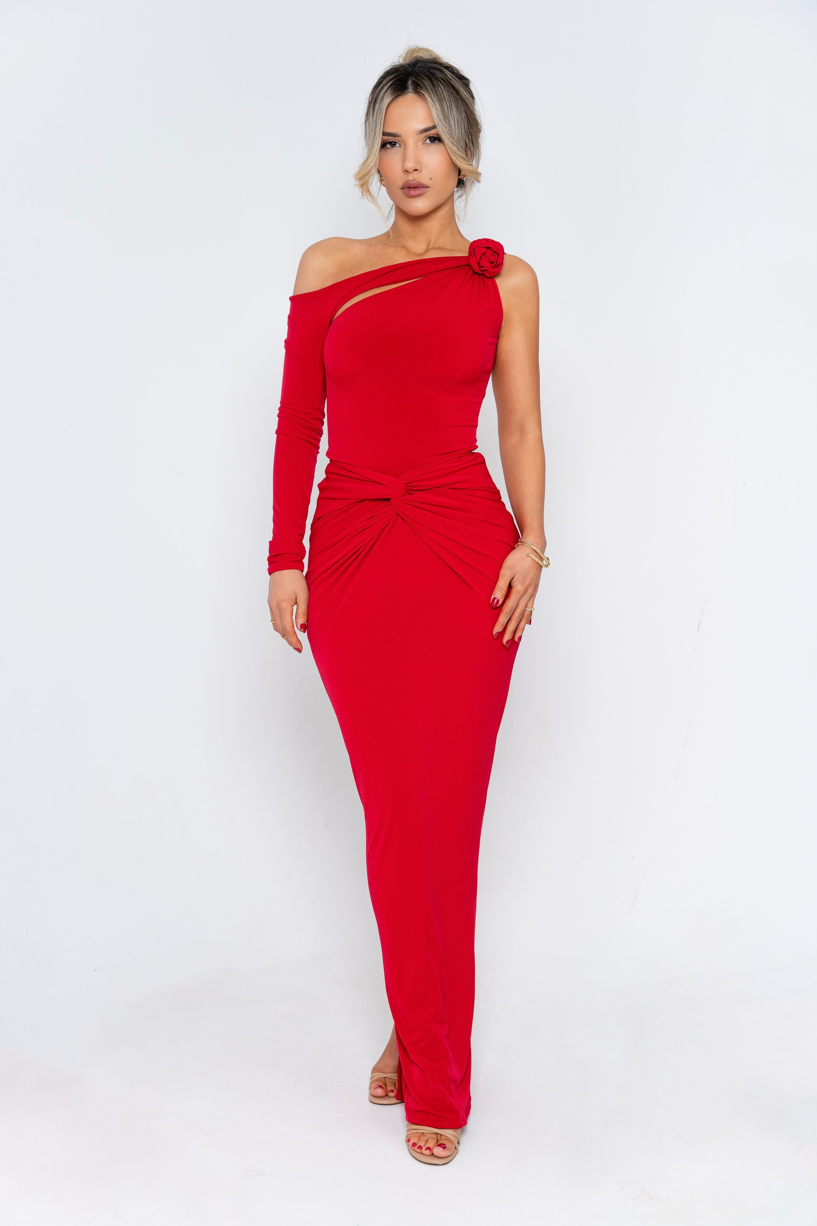 
A striking red evening gown featuring an asymmetrical one-shoulder design and a figure-hugging silhouette for a bold and elegant look.