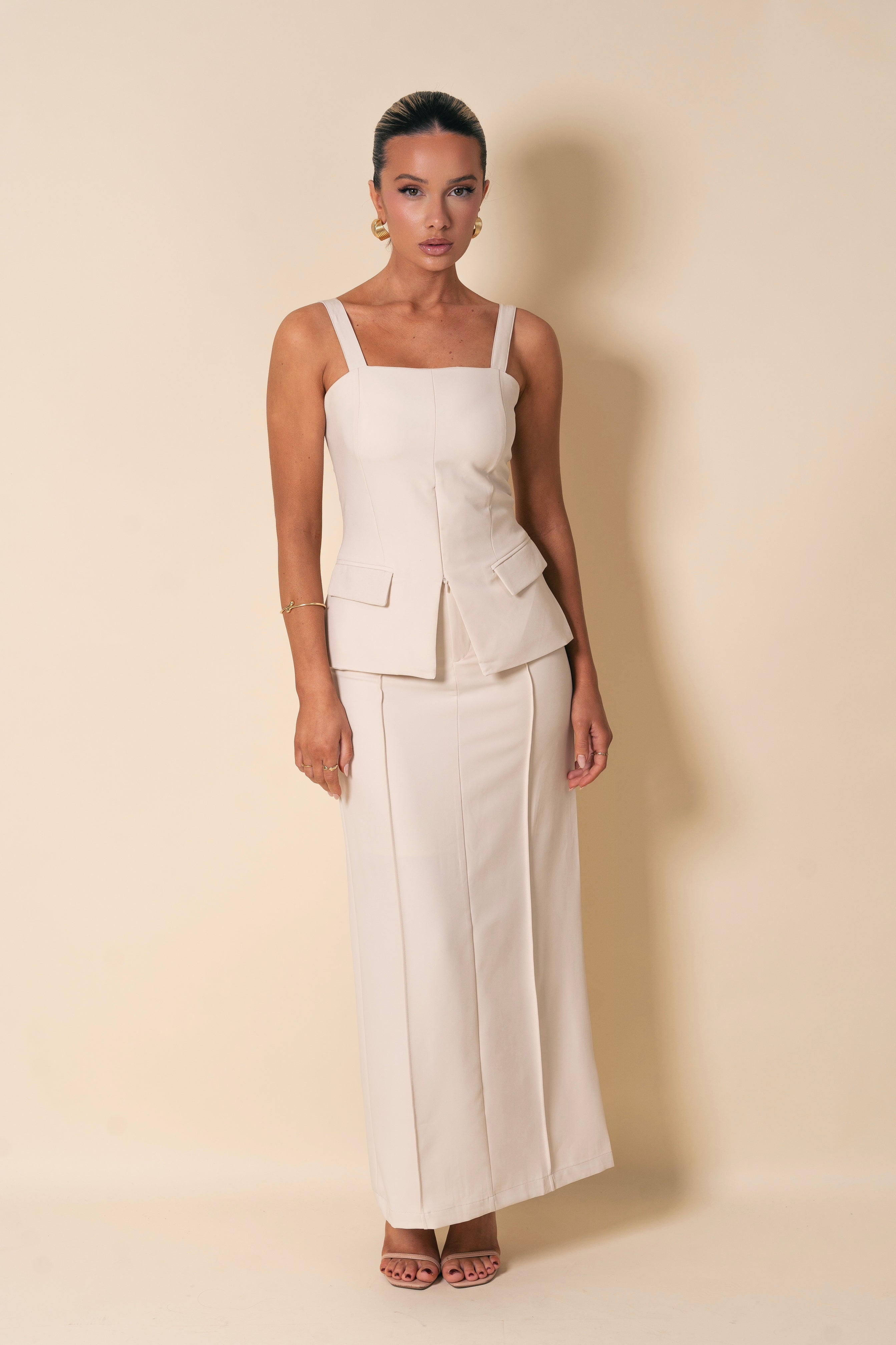 Modern white two-piece with a refined, structured fit.