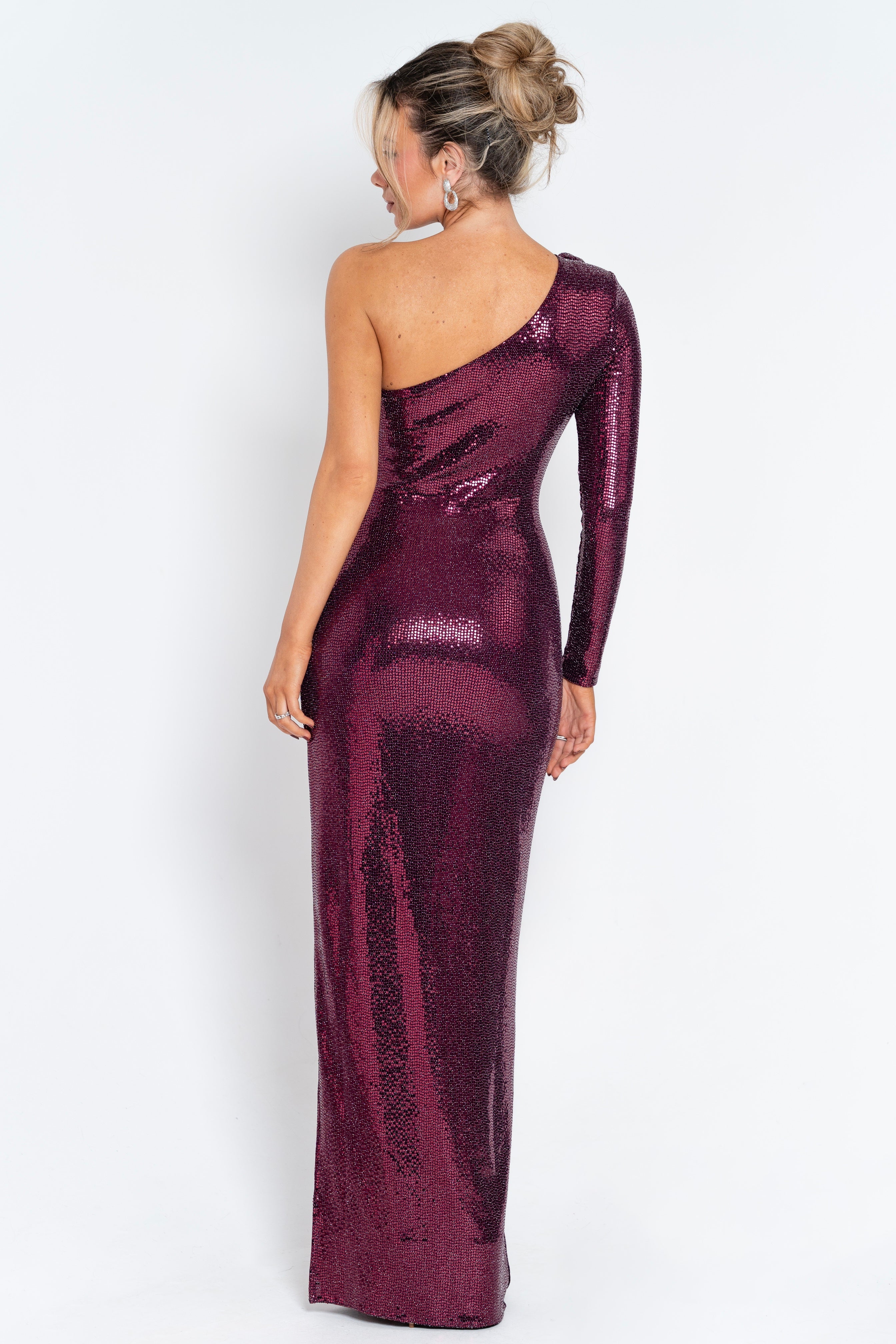 Radiant full-length burgundy gown with sparkling sequins and a modern, asymmetric neckline