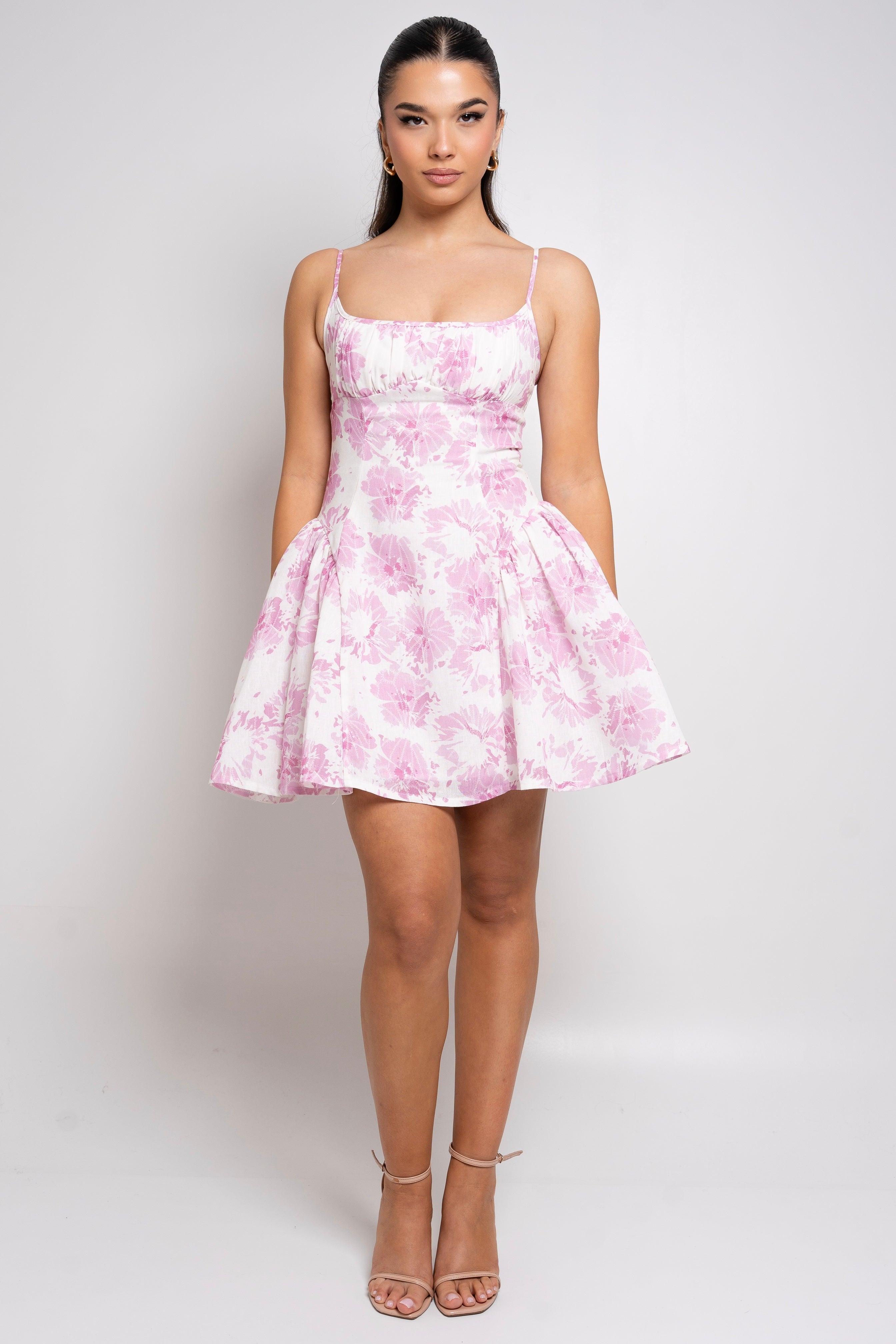 Pink and white floral mini dress with spaghetti straps.