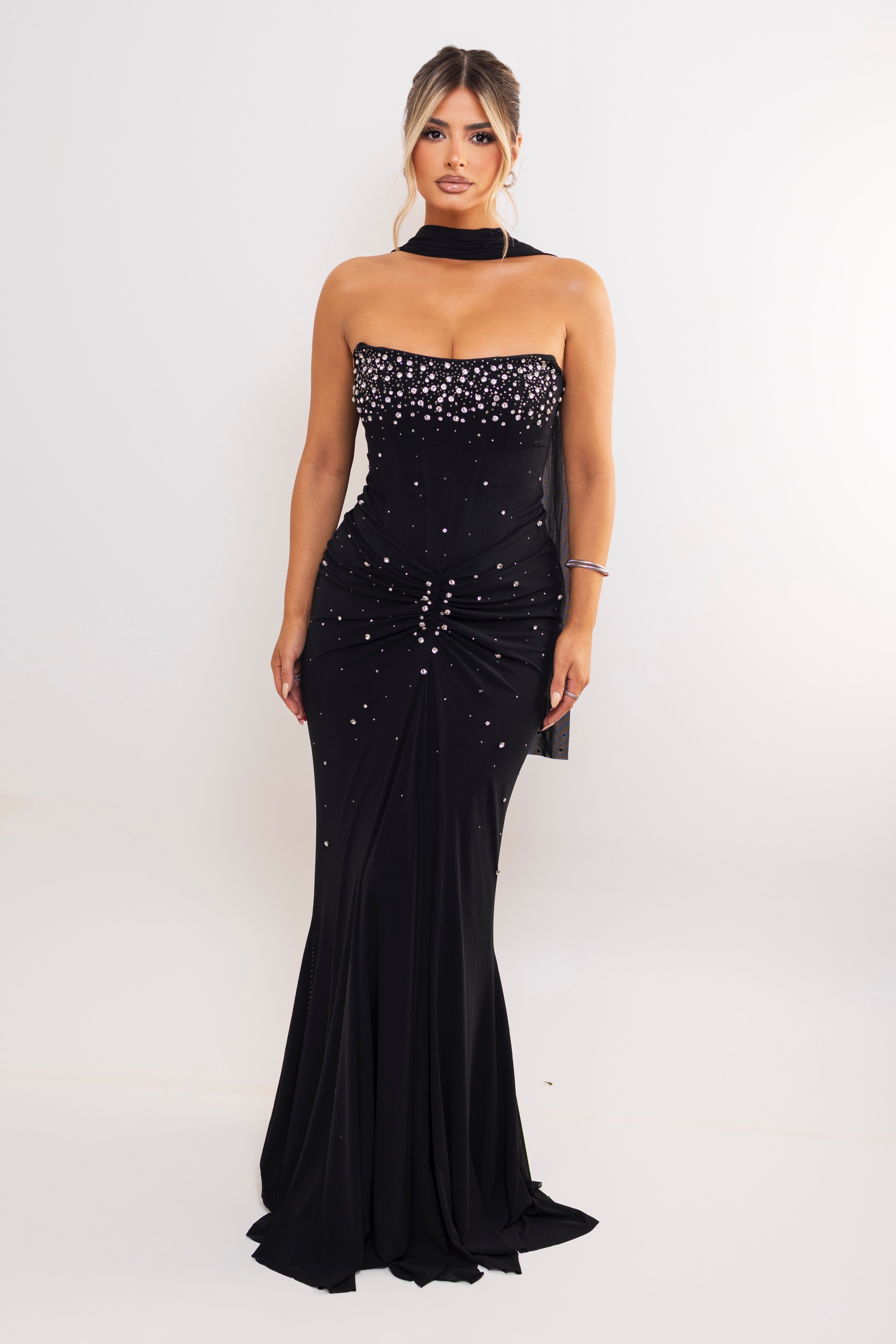 Strapless black gown with crystal embellishments.