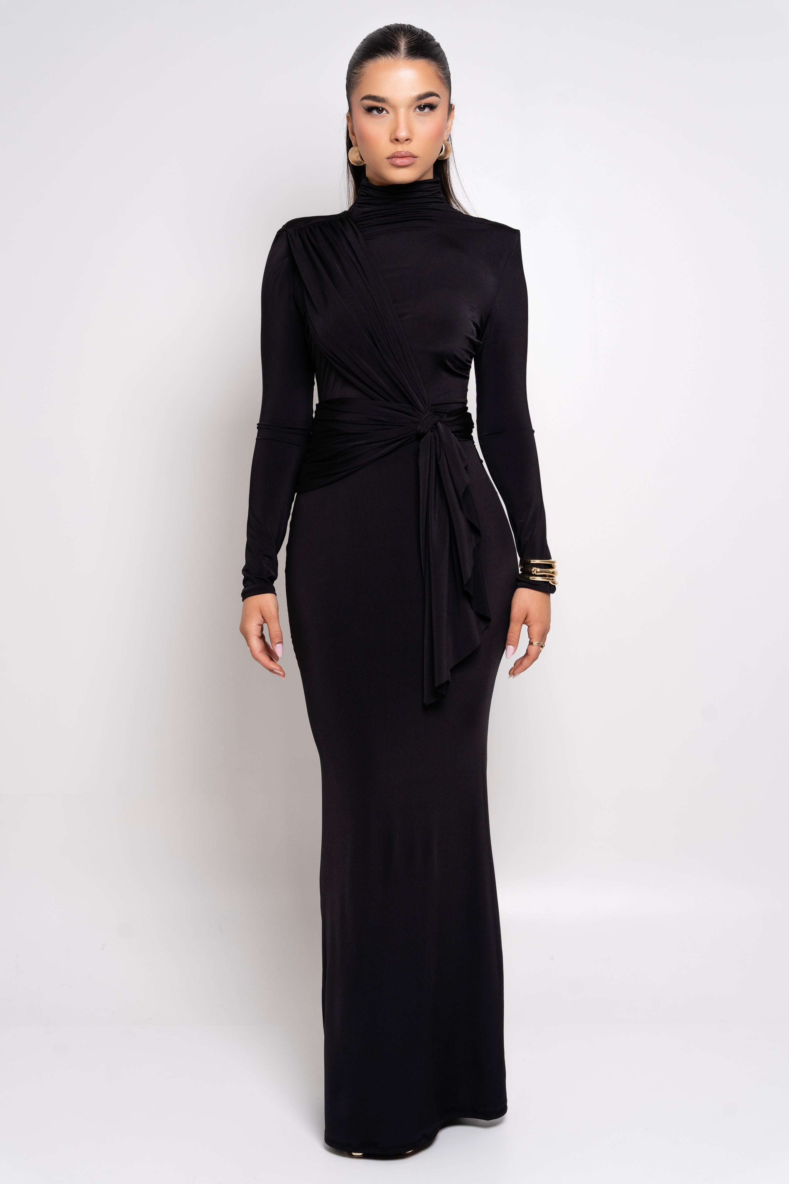 Timeless black dress featuring long sleeves and a sleek bodycon fit.