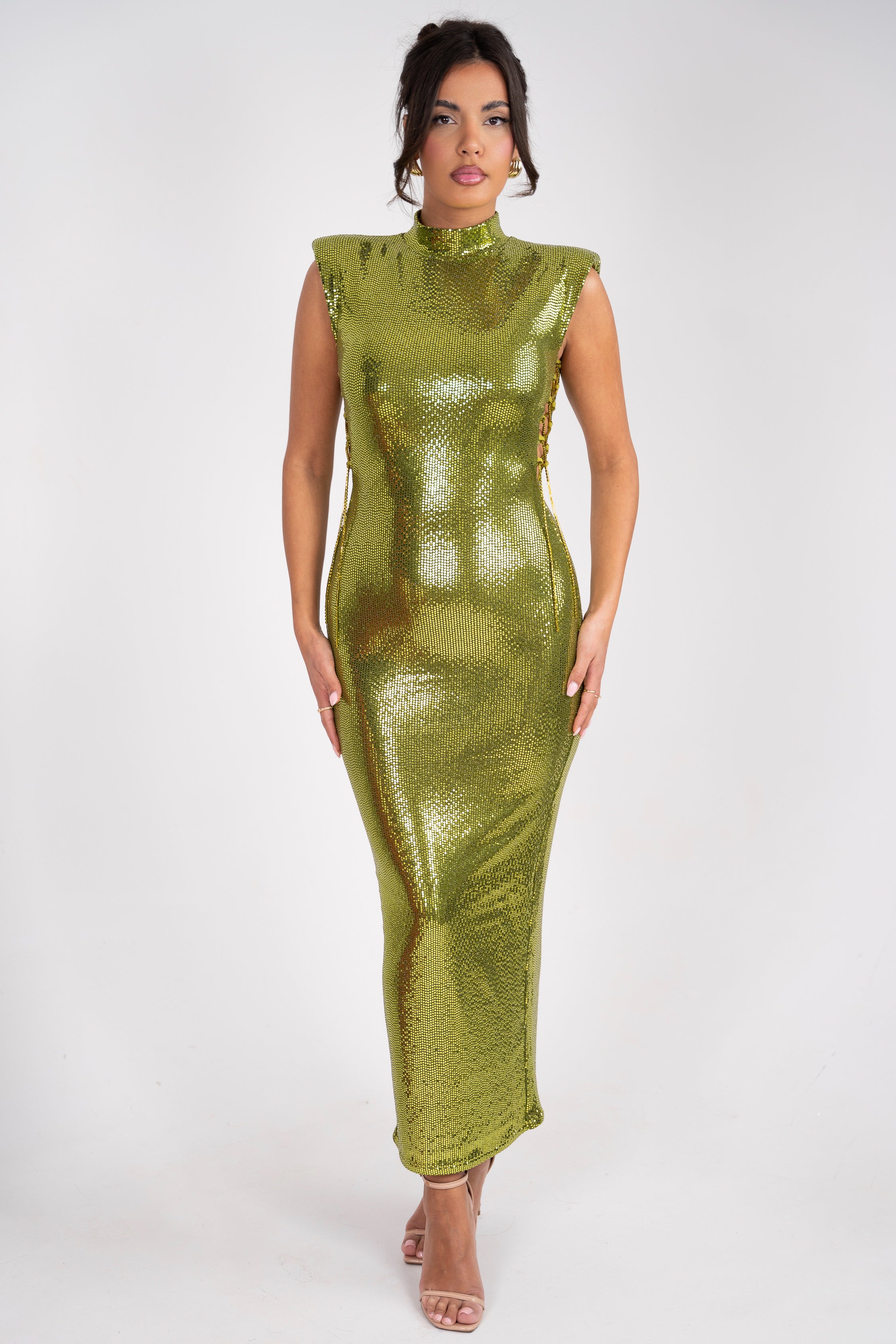 Shiny gold-green metallic dress with a high neckline