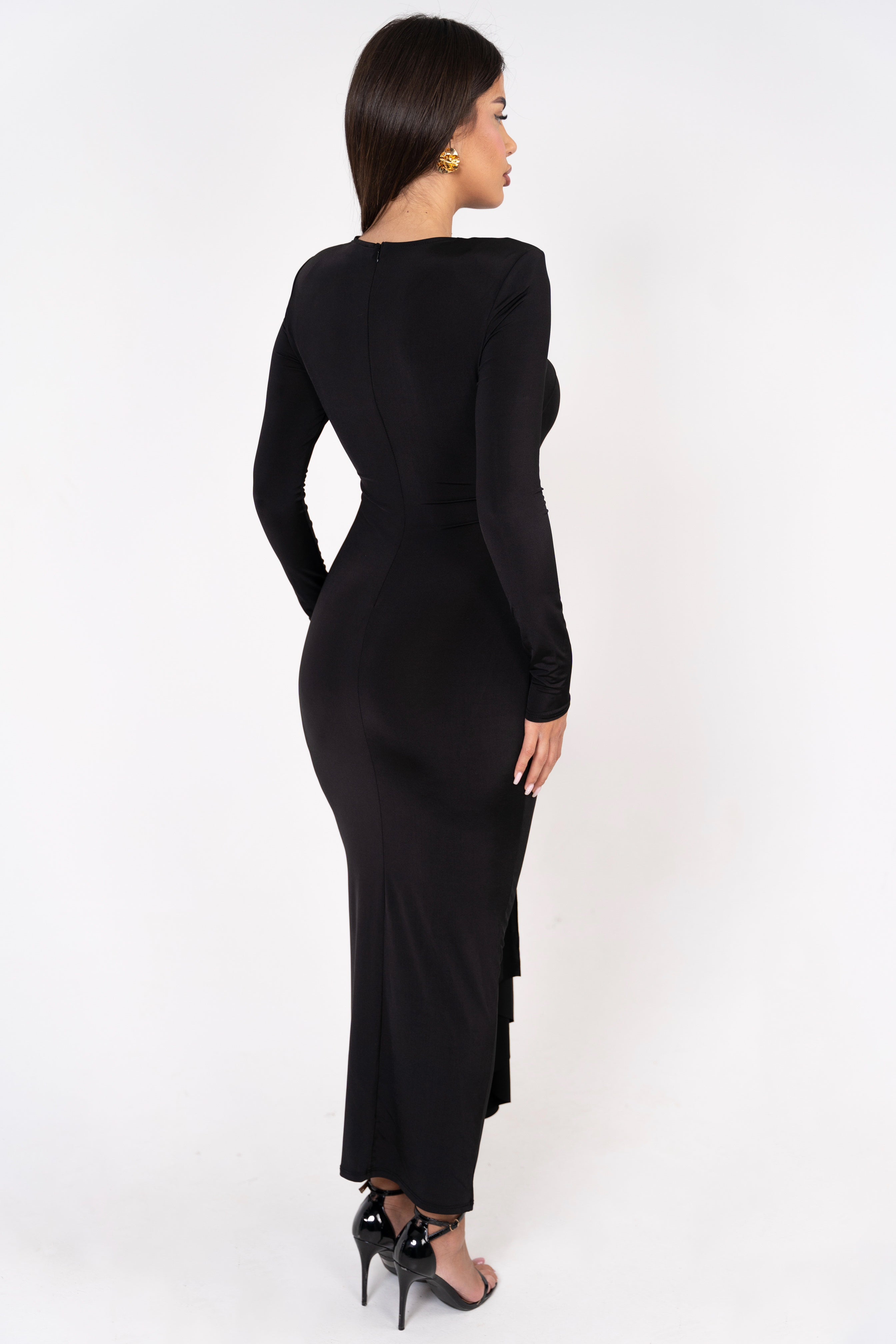 Black formal gown designed with subtle elegance and a standout drape