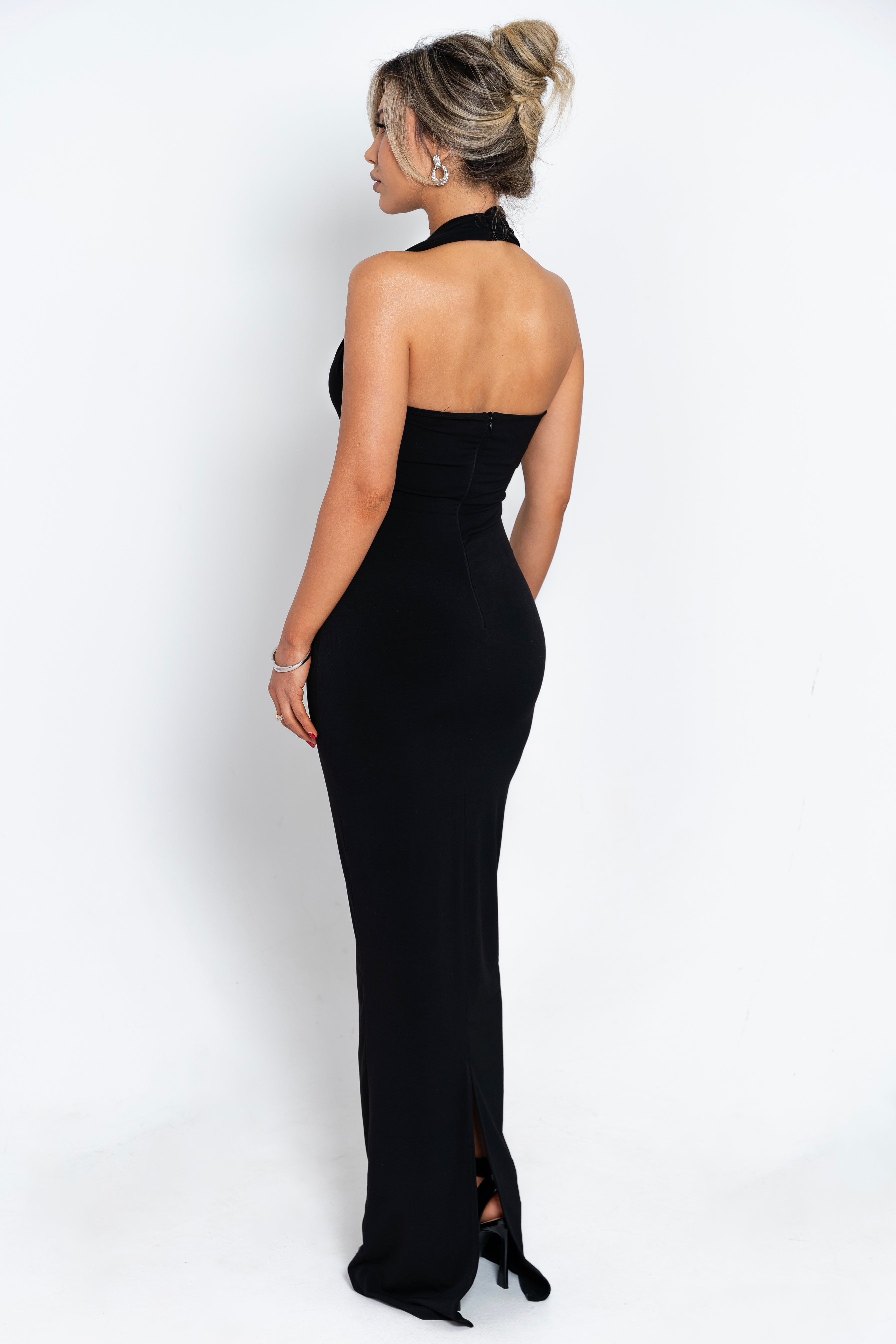 Timeless black evening dress with a flattering draped front and jeweled waist detail, perfect for creating a sophisticated look.