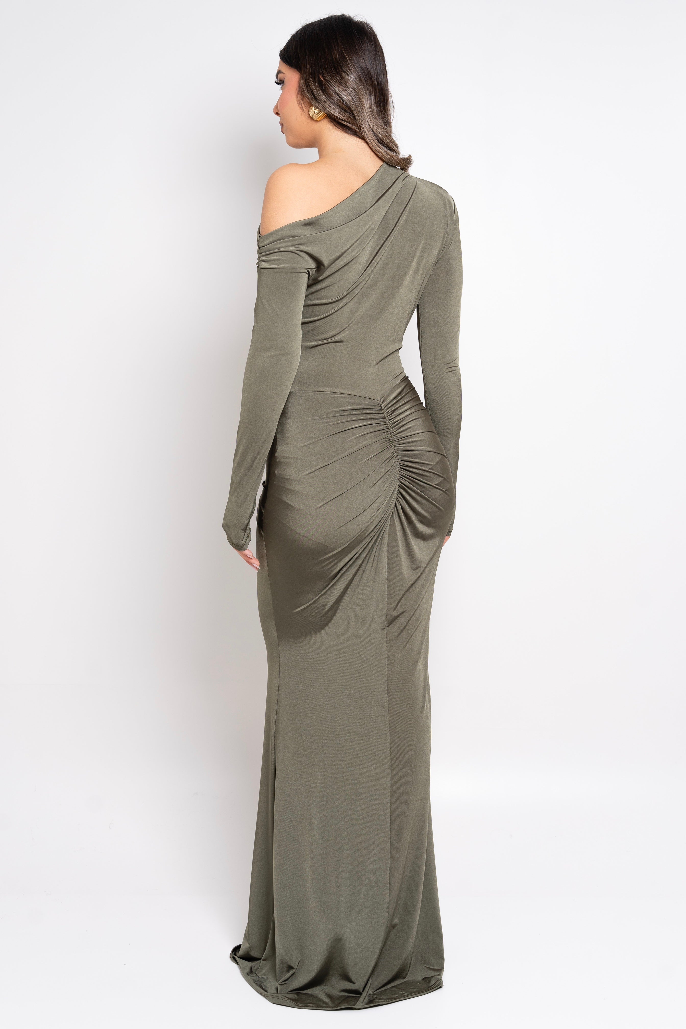 Model wearing a sophisticated olive-colored dress with a twist detail.