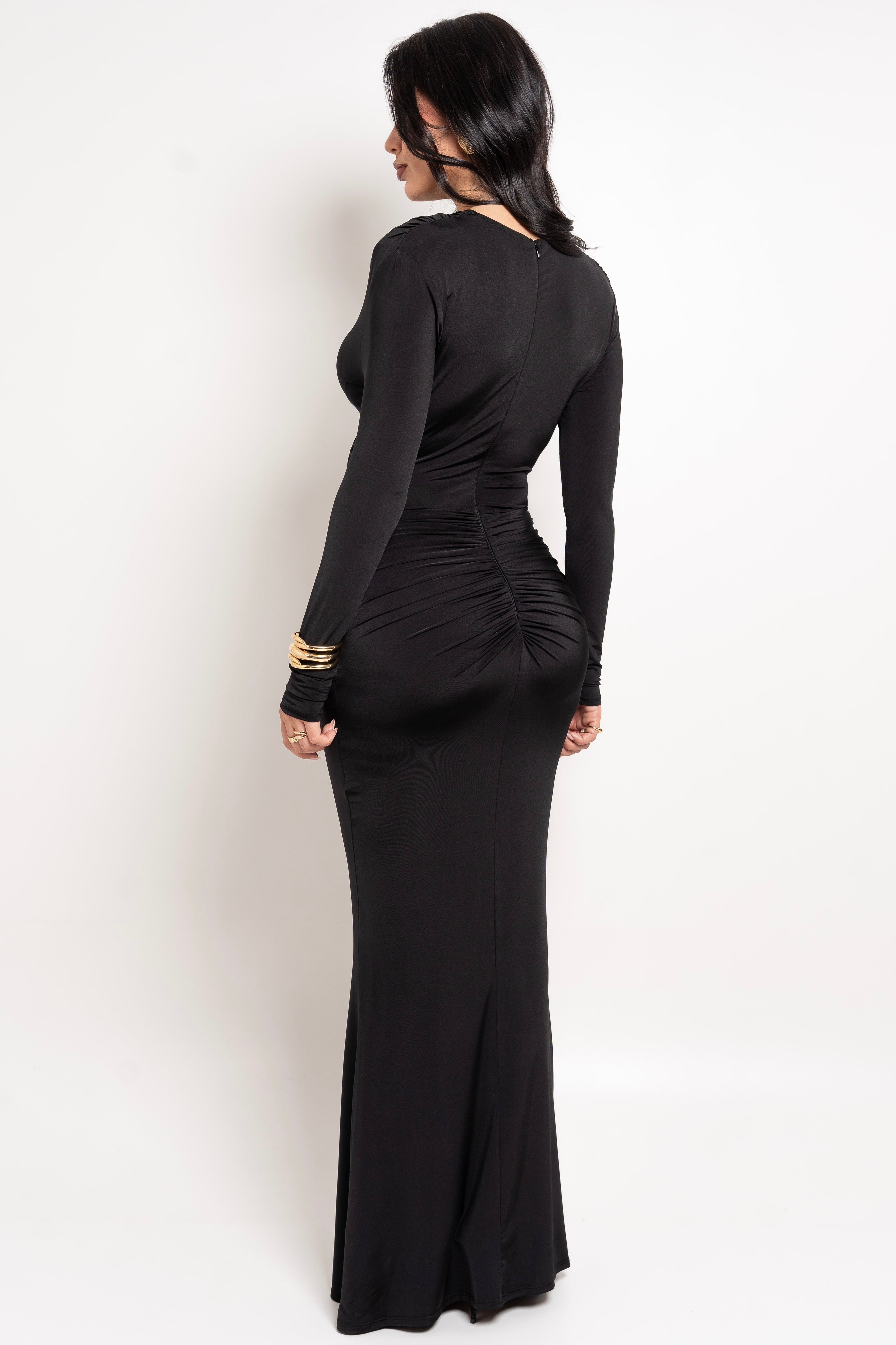 Dramatic black maxi dress with a ruched back for added flair.