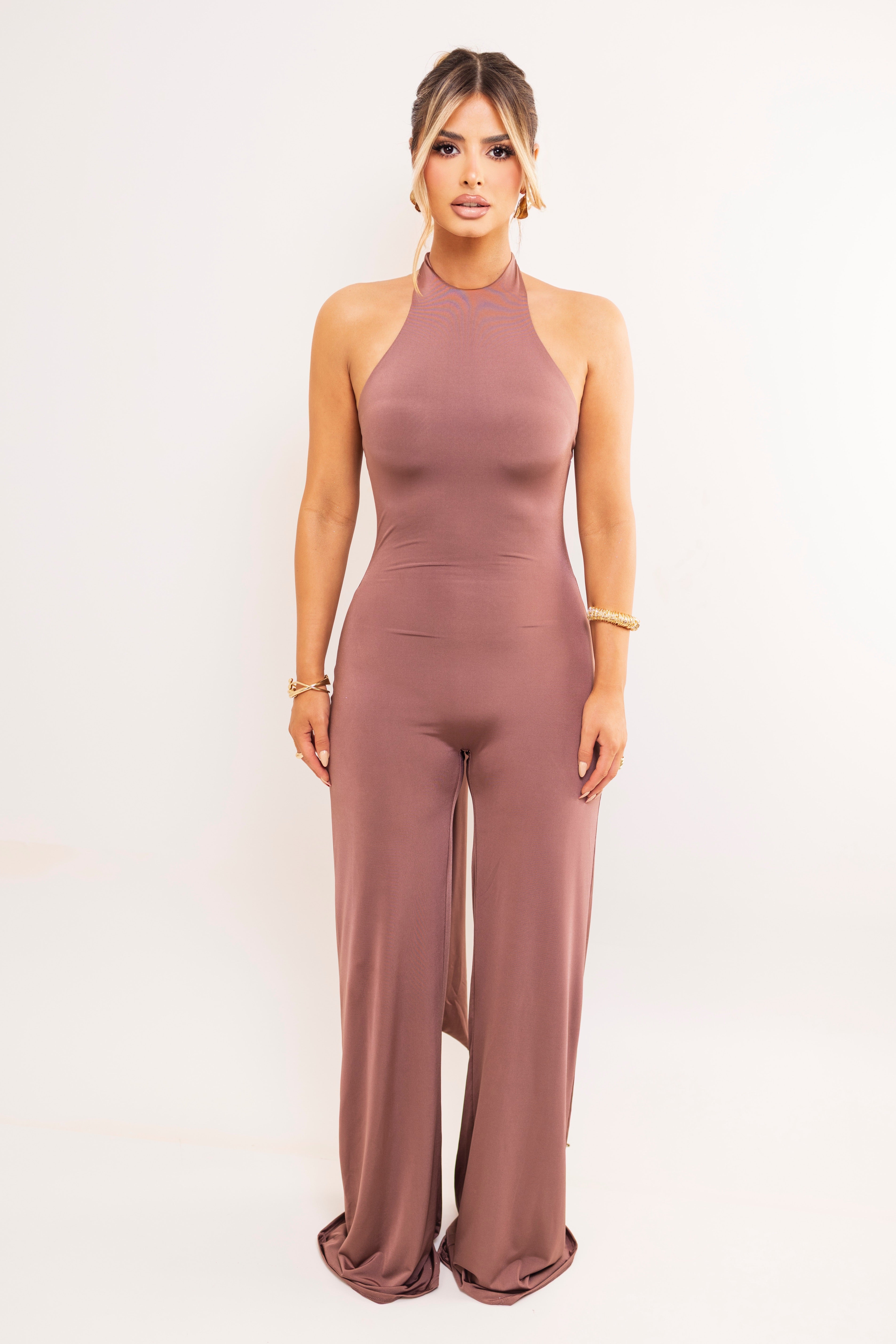 Sleeveless halter jumpsuit in soft mocha tone.