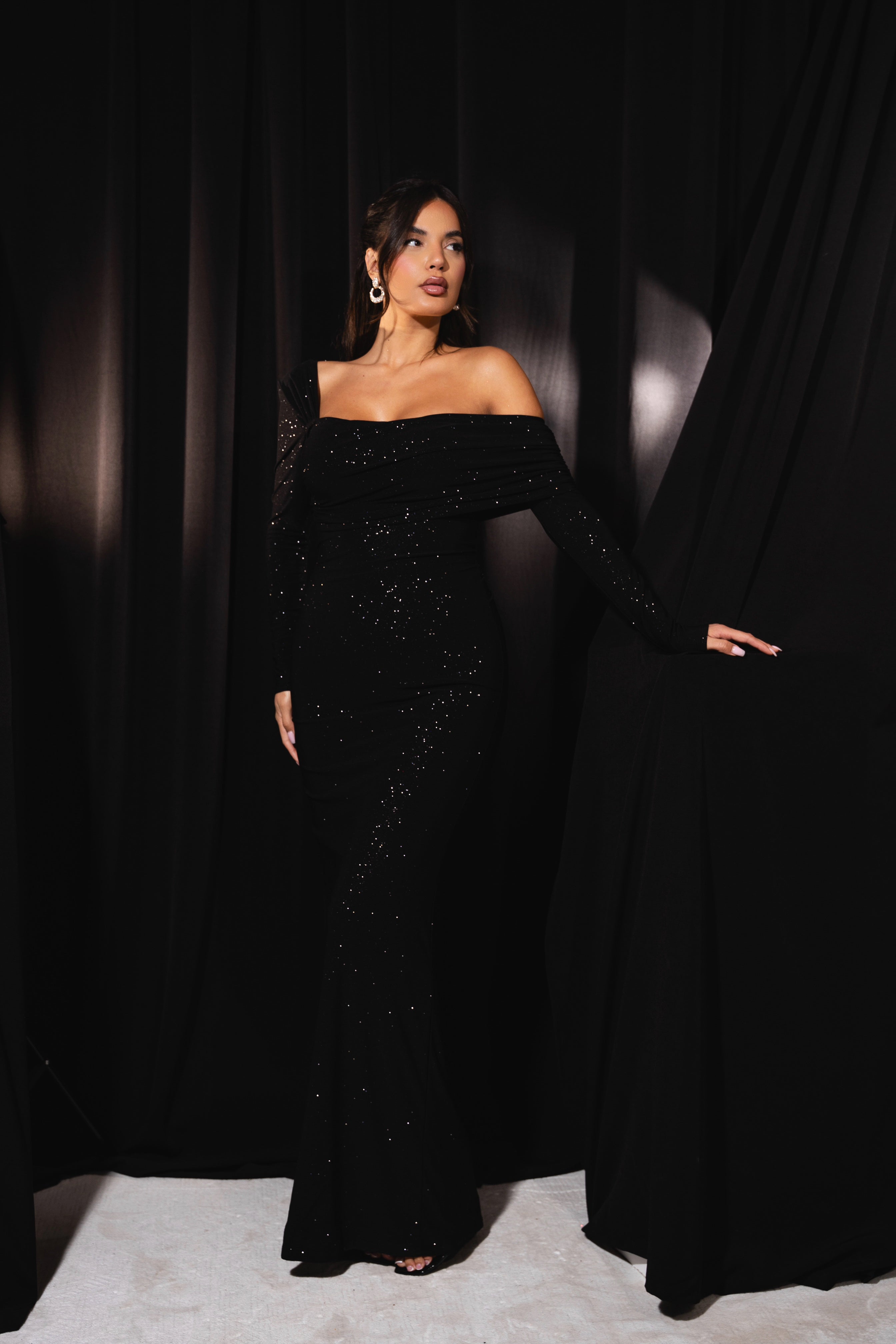 Black gown with a modern off-shoulder style