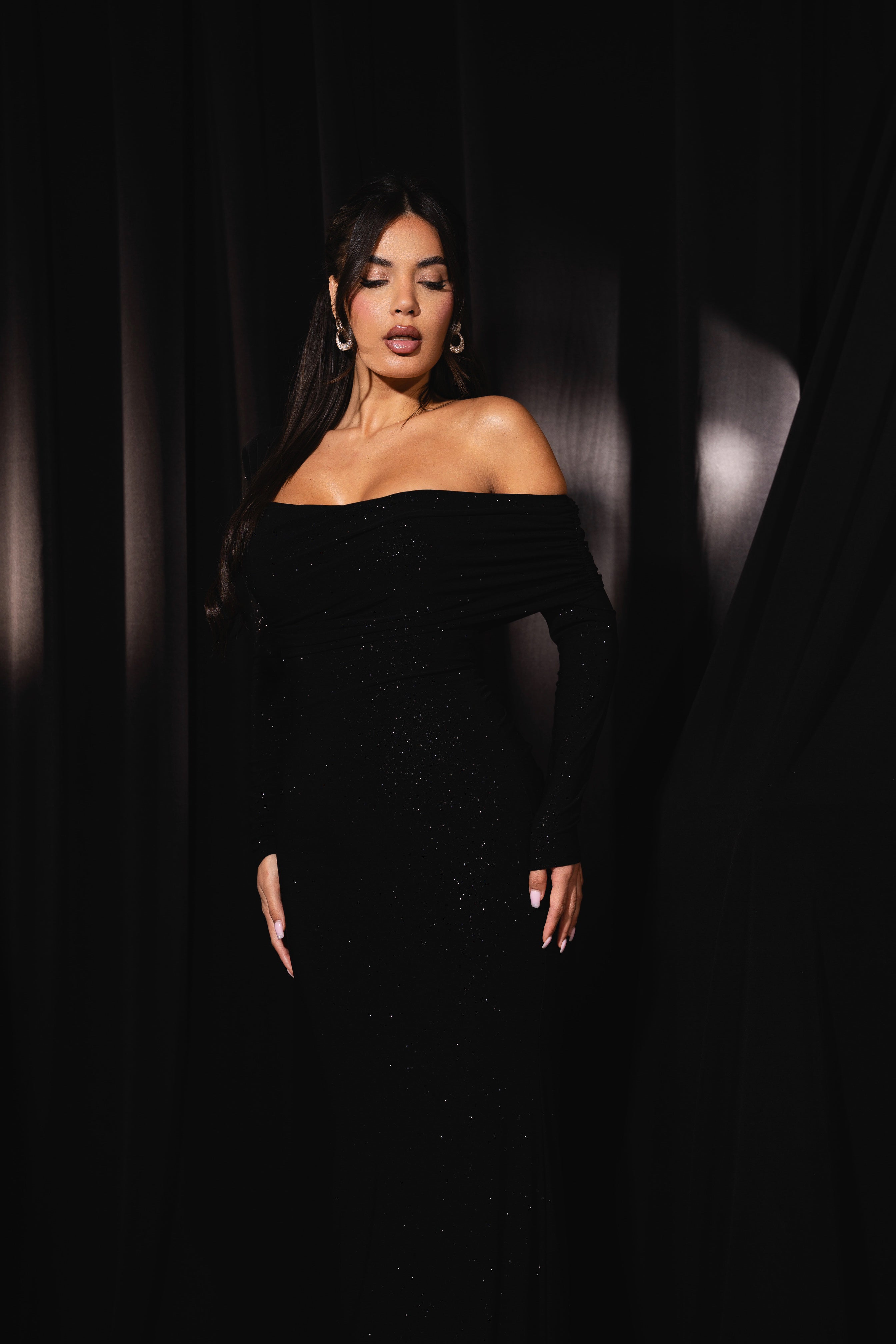 Minimalist black gown with sparkling accents