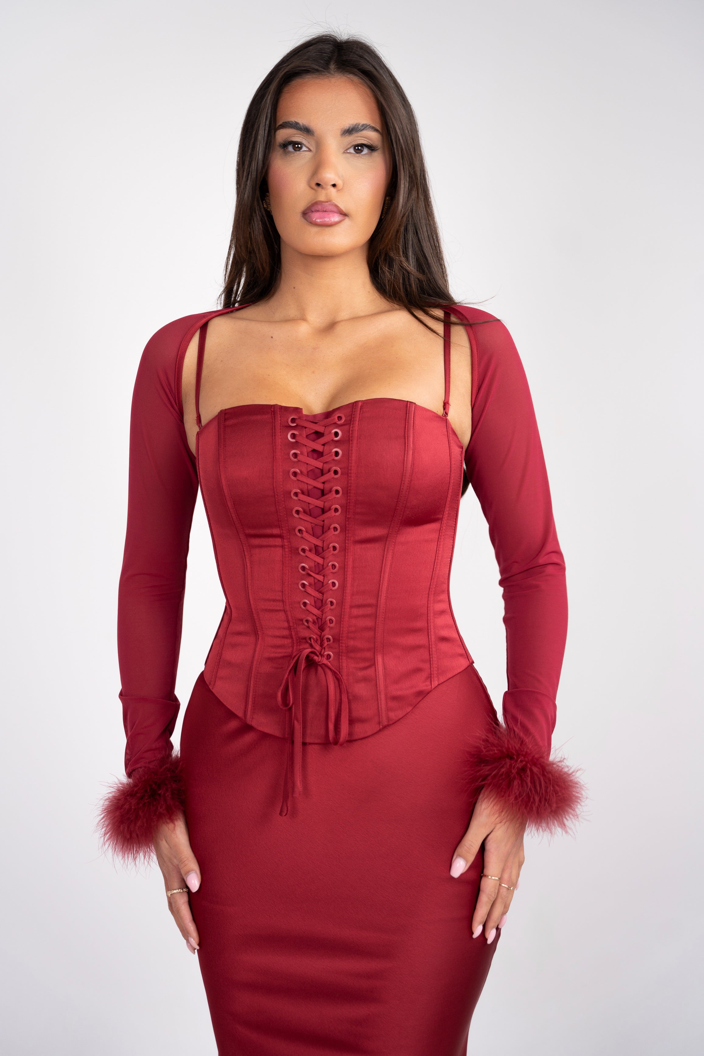 Elegant red two-piece with a fitted corset and mermaid skirt