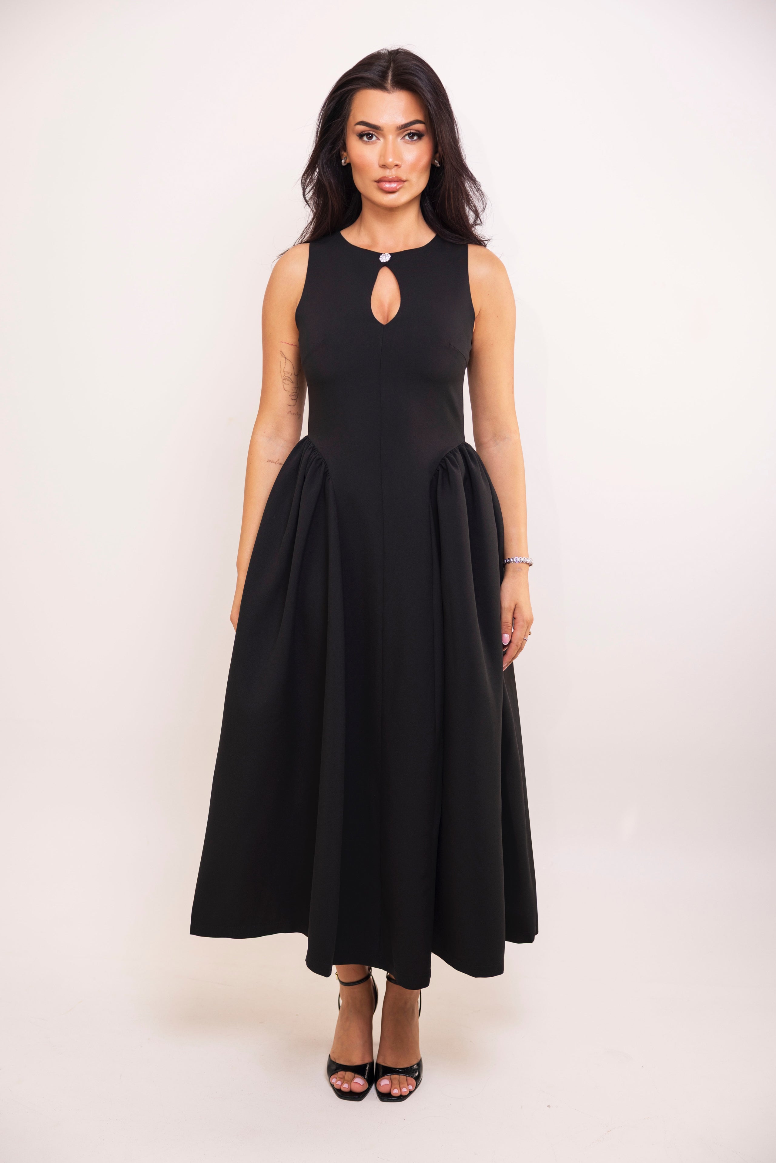 Black sleeveless midi dress with a keyhole neckline and flared skirt.
