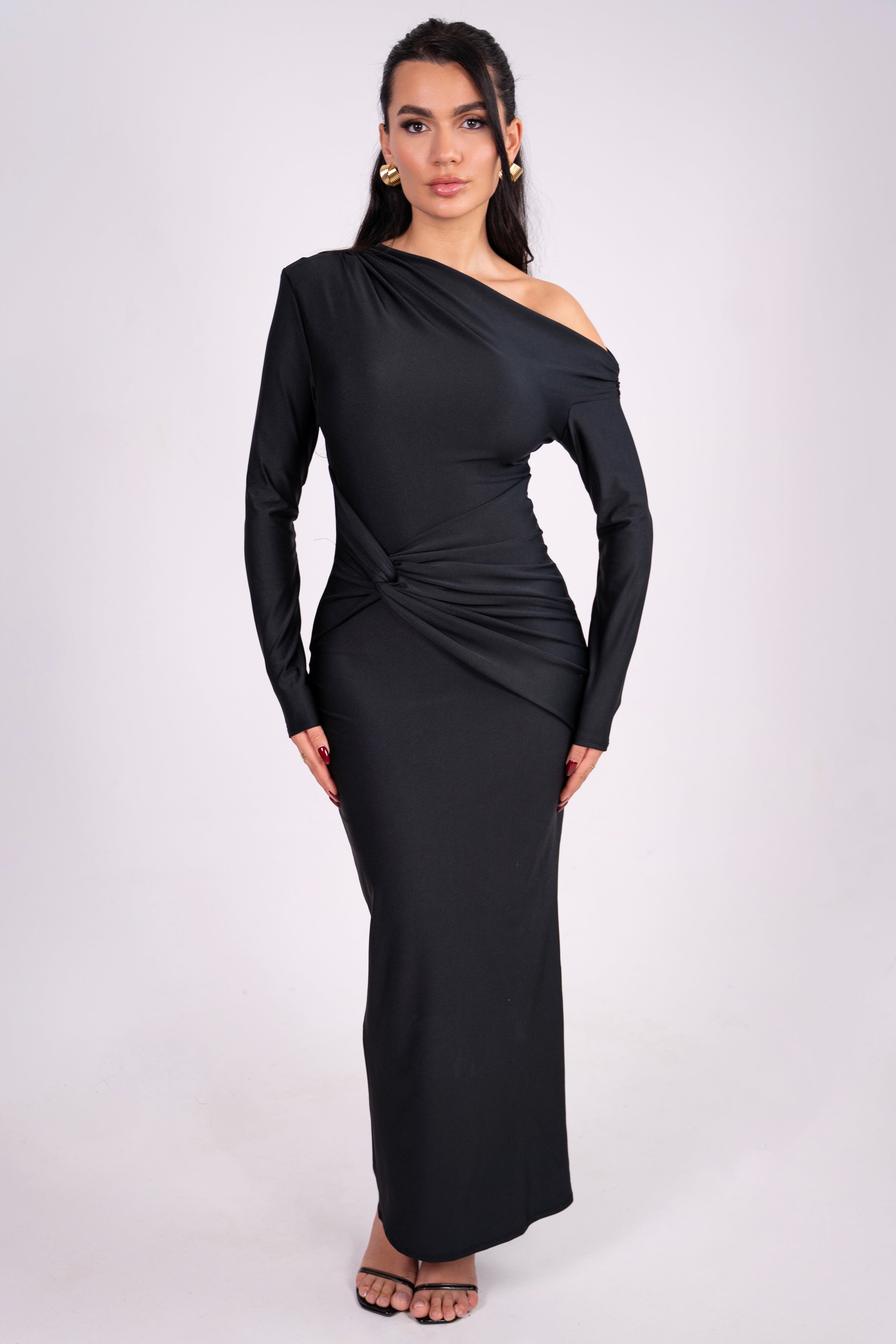 Elegant black dress with an off-shoulder neckline and draped waist detail