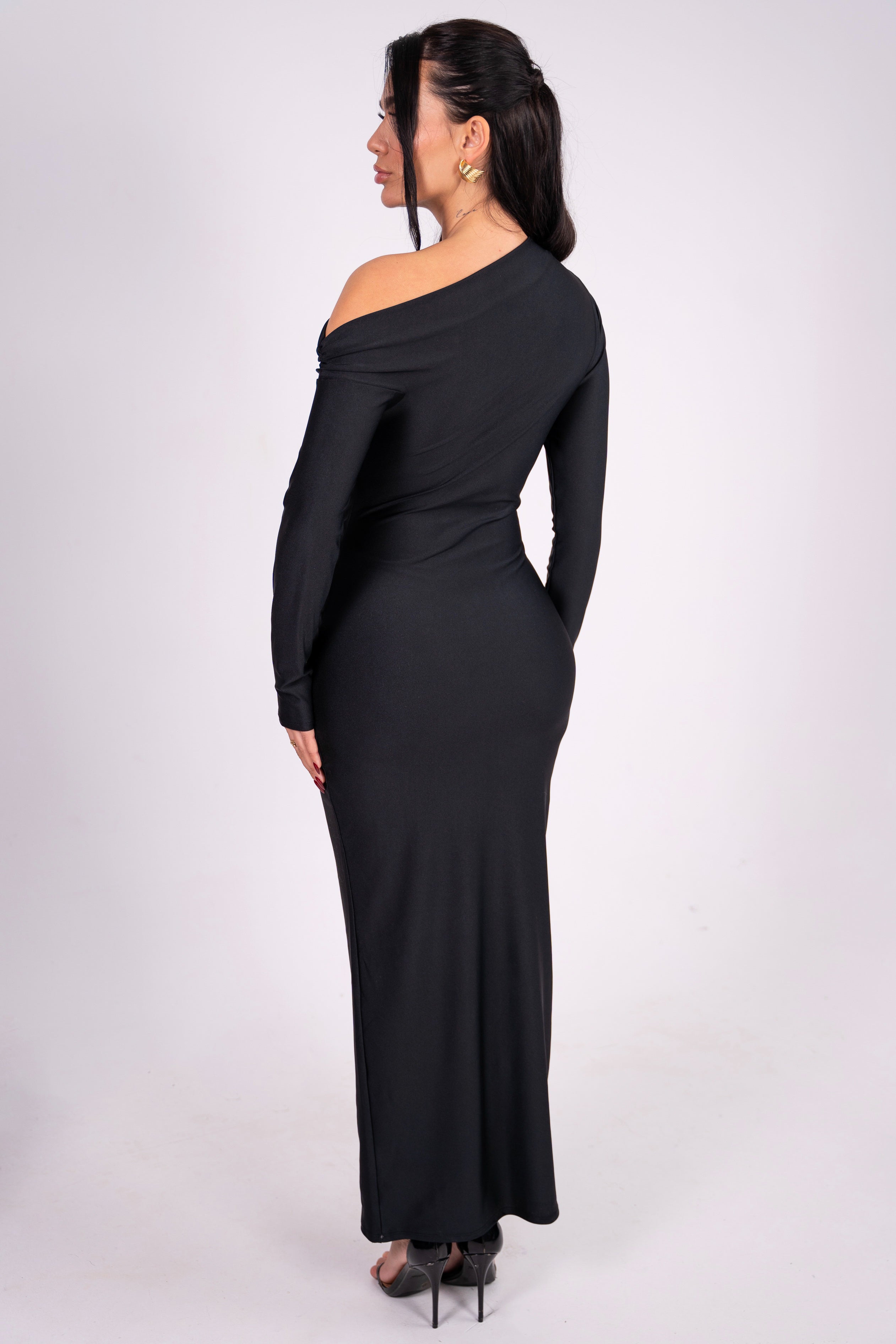 Modern black dress highlighting a knotted waist and chic one-shoulder style