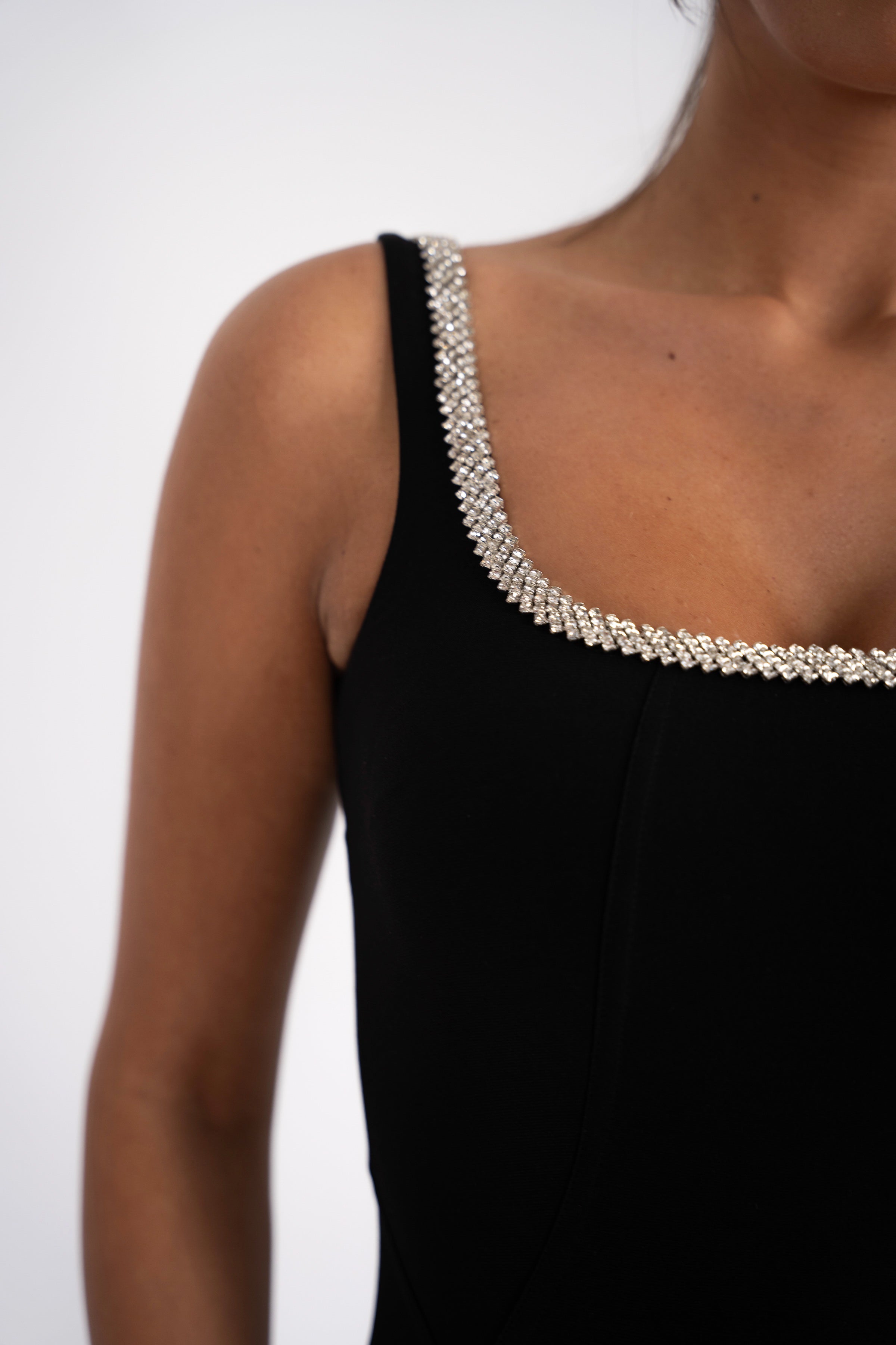 Close-up of a black evening dress with sparkly details