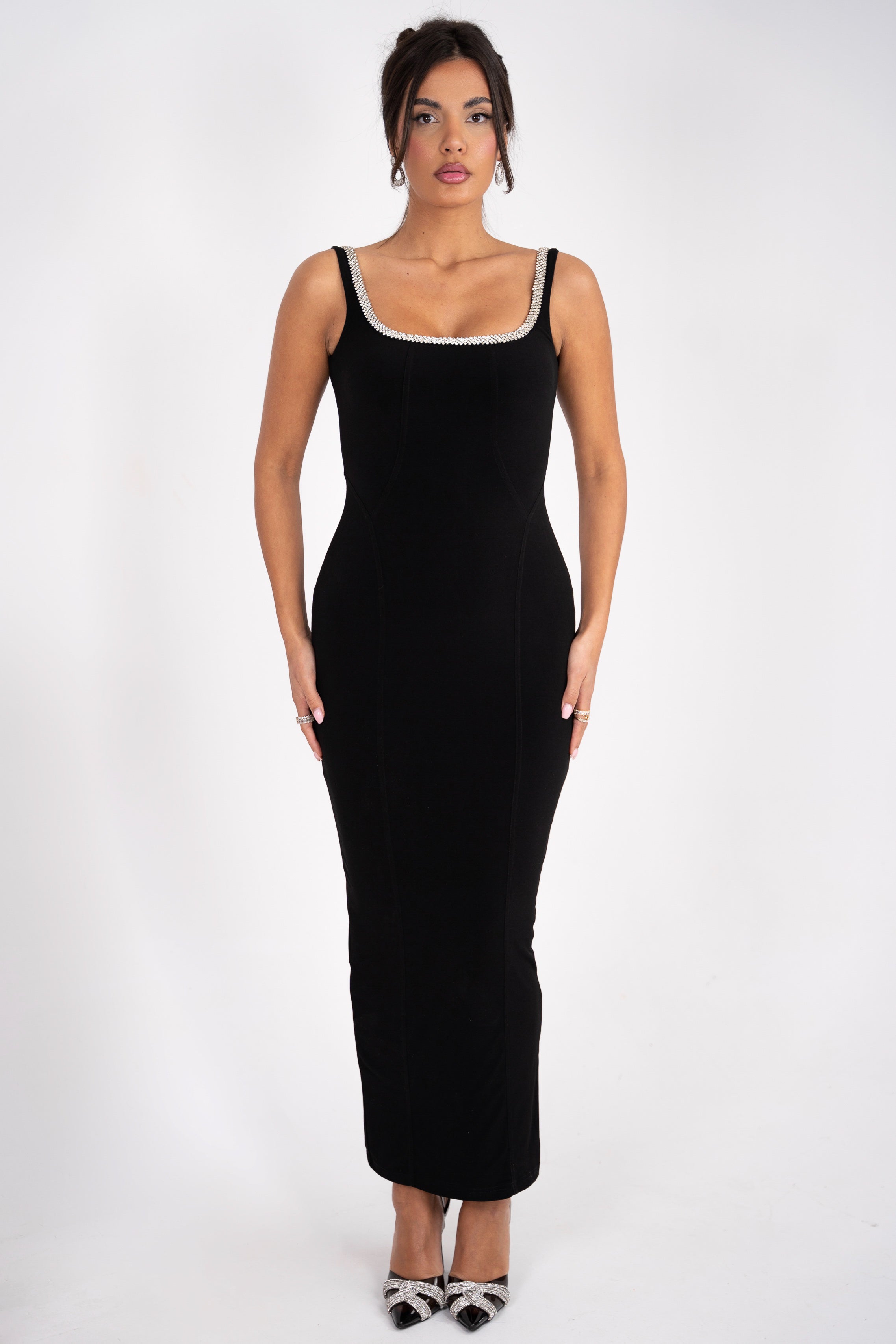 Elegant black dress with rhinestone-trimmed neckline