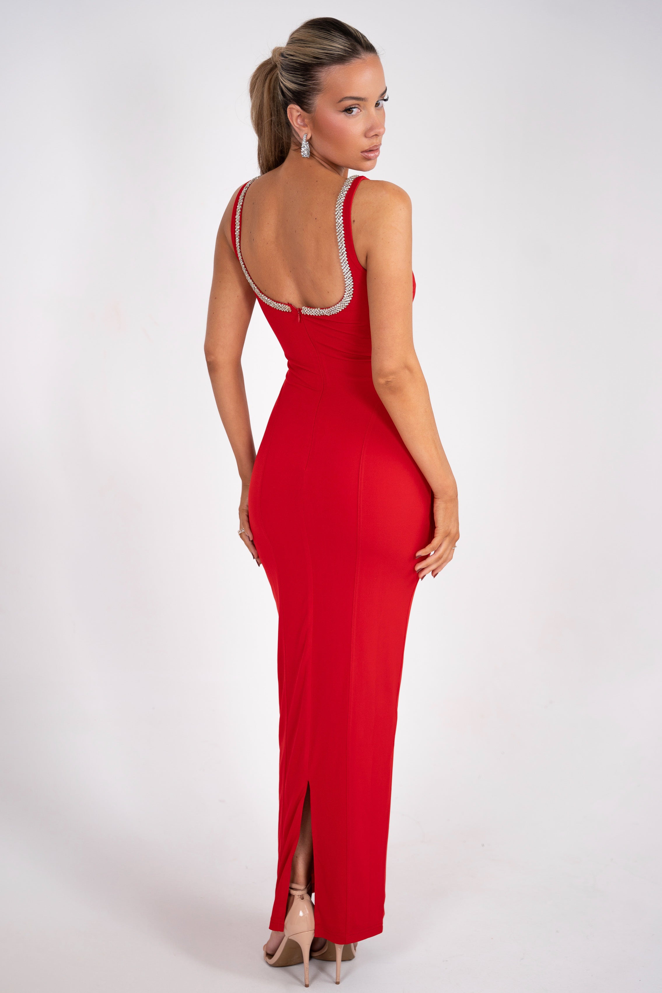 Form-fitting red dress highlighting stitching details