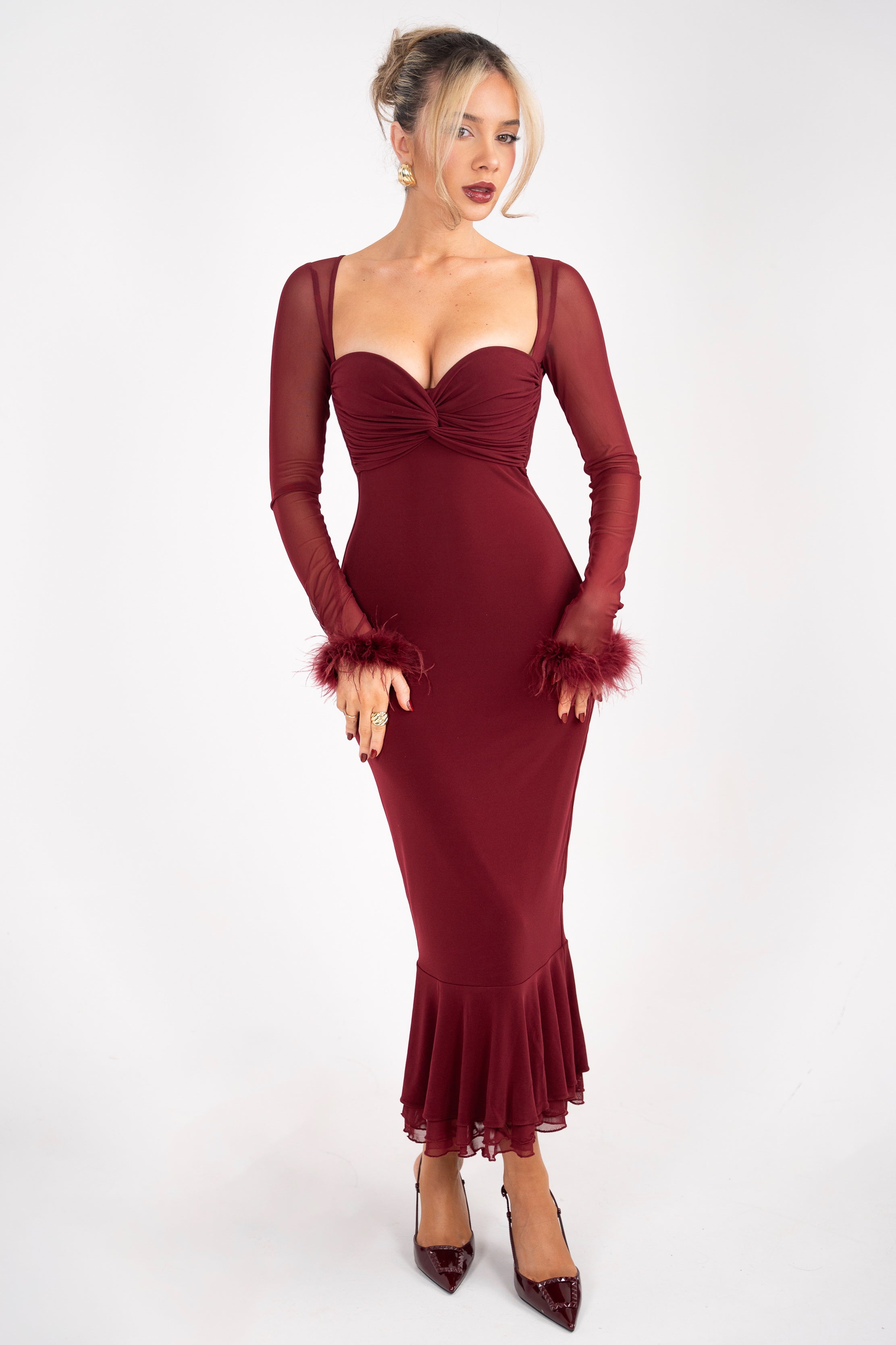 Elegant burgundy dress with long sheer sleeves and feather cuffs