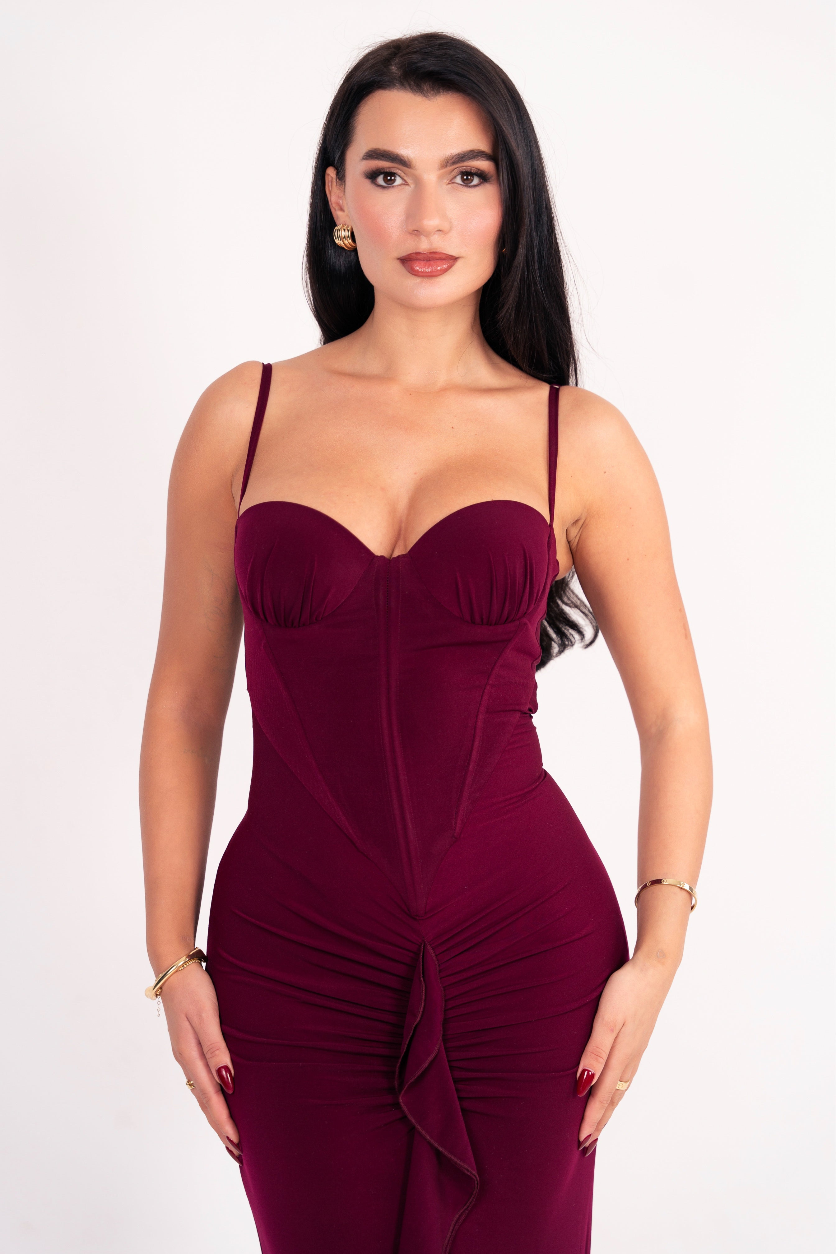 Rich maroon dress with a figure-flattering silhouette and front ruching.